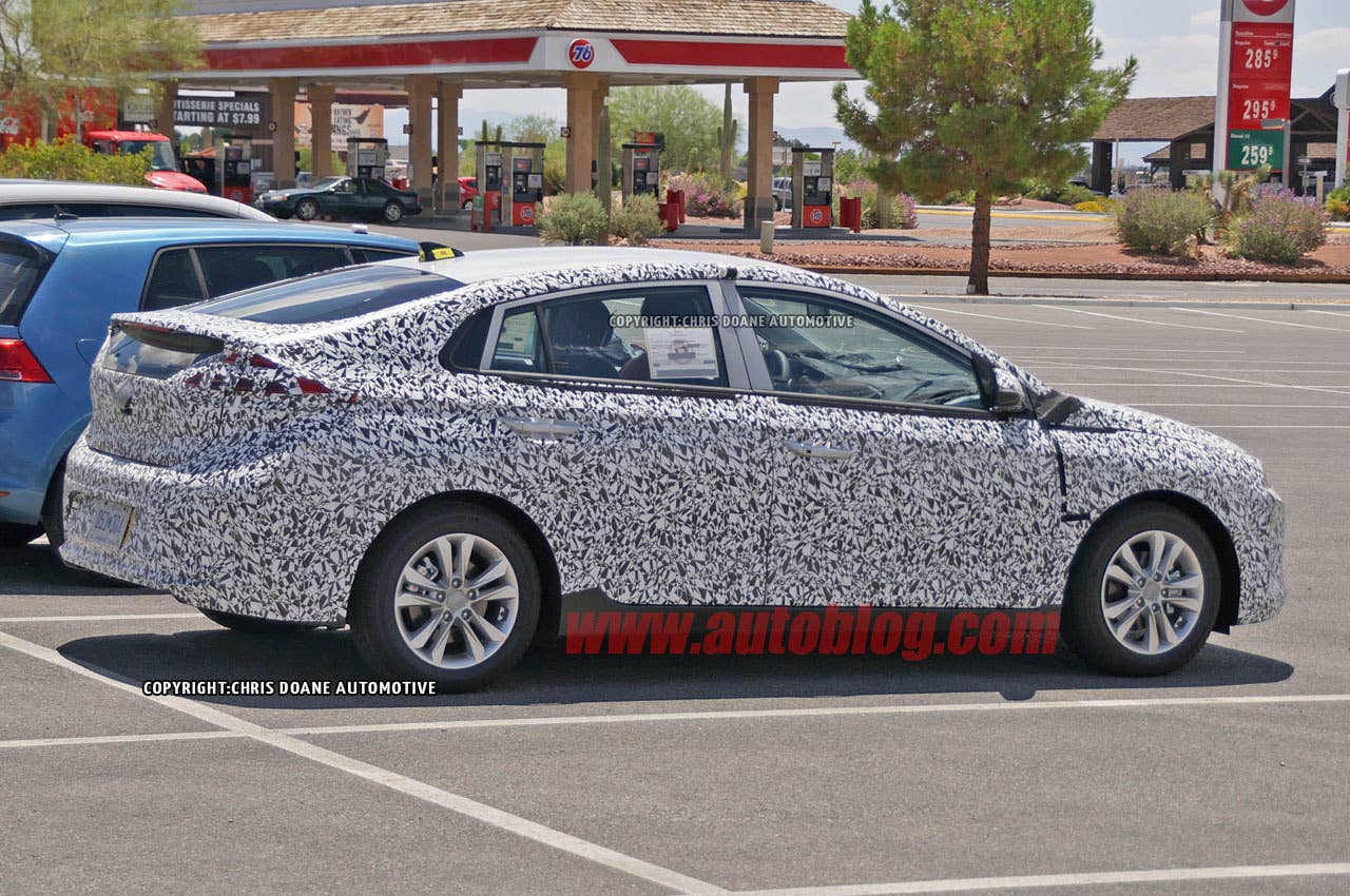 camouflaged hyundai prius-fighter spy shot rear three quarters