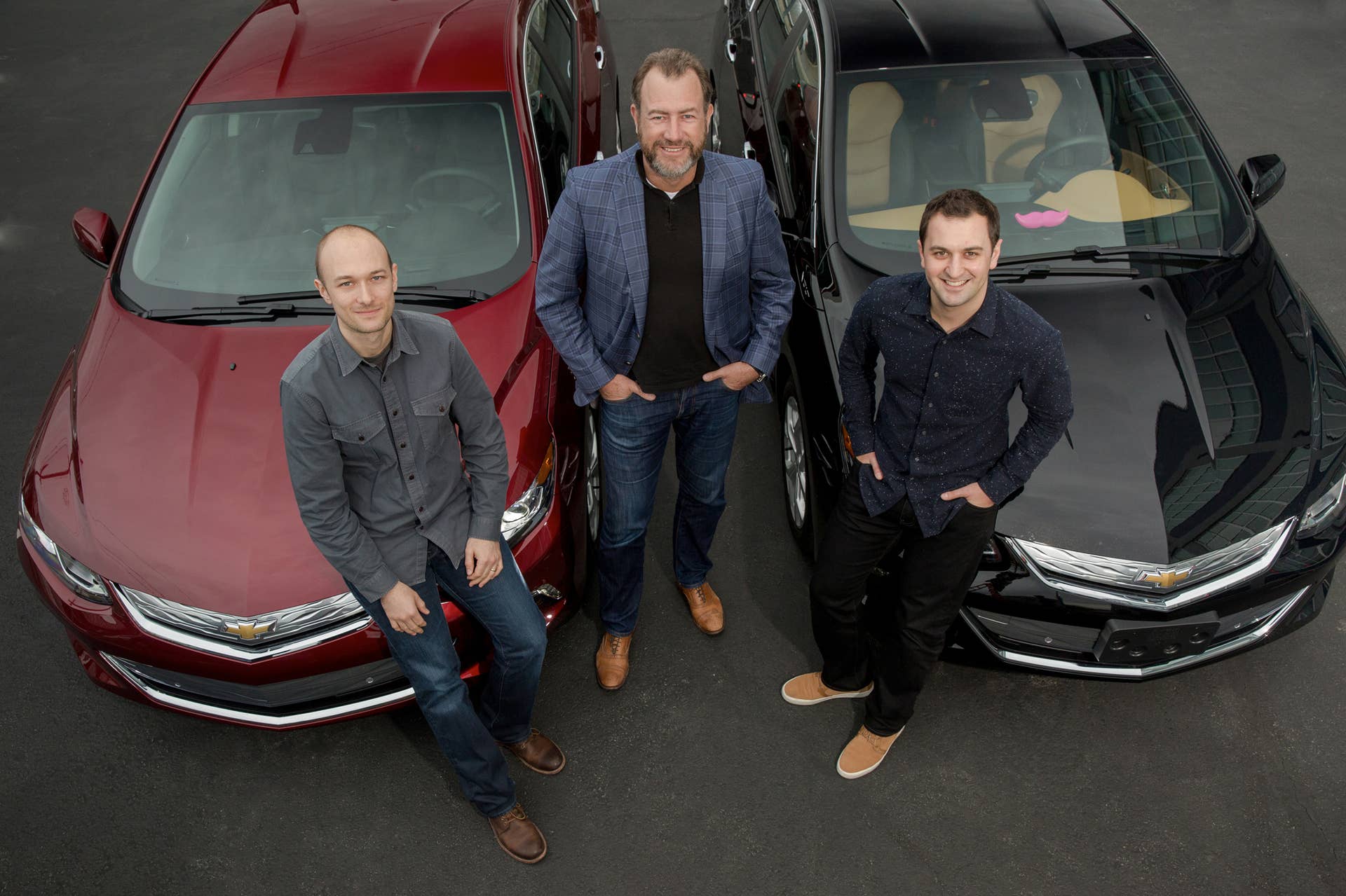 General Motors President Dan Ammann with Lyft co-founders John Zimmer and Logan Green