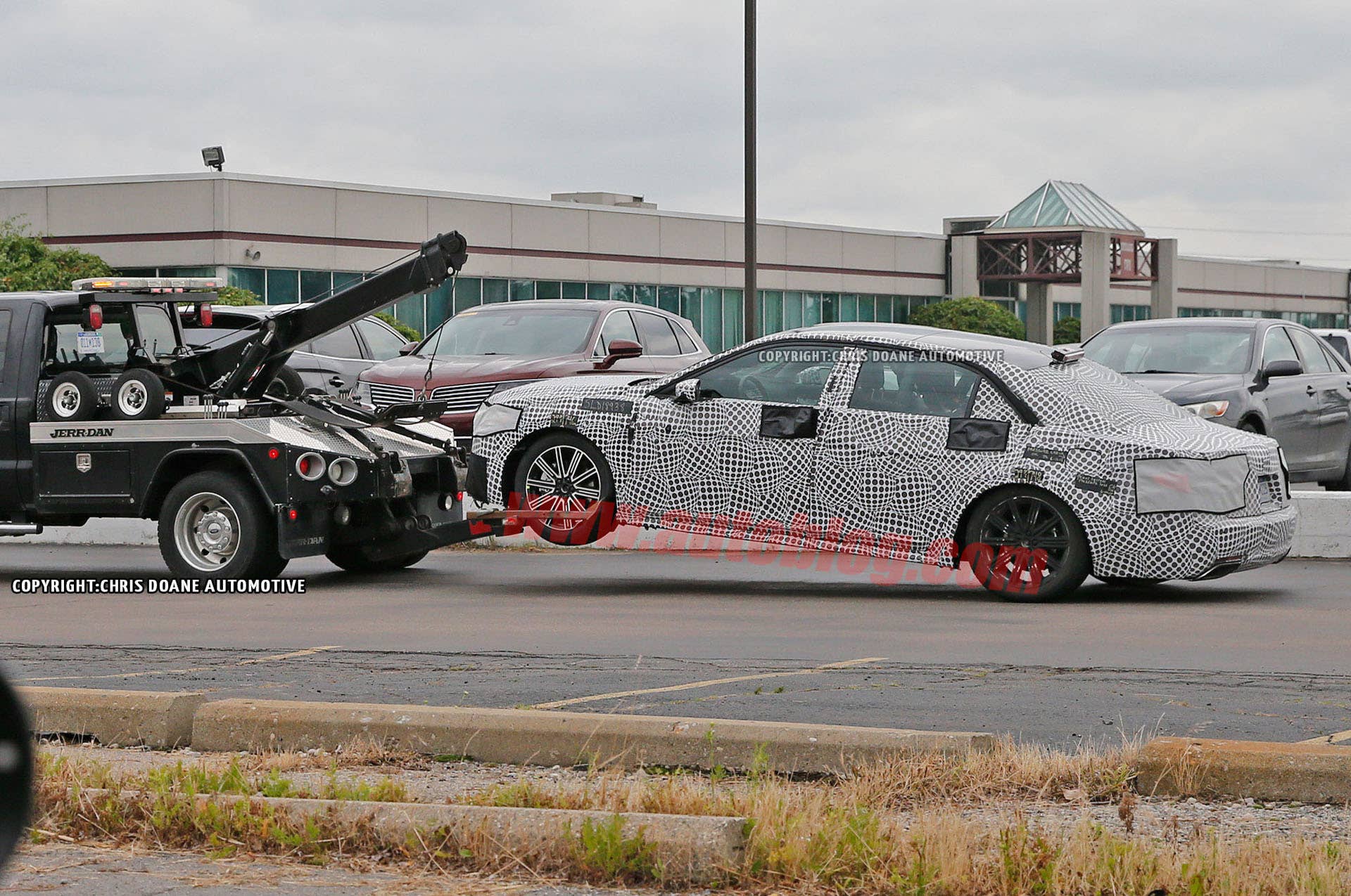 spied lincoln continental broken tow truck