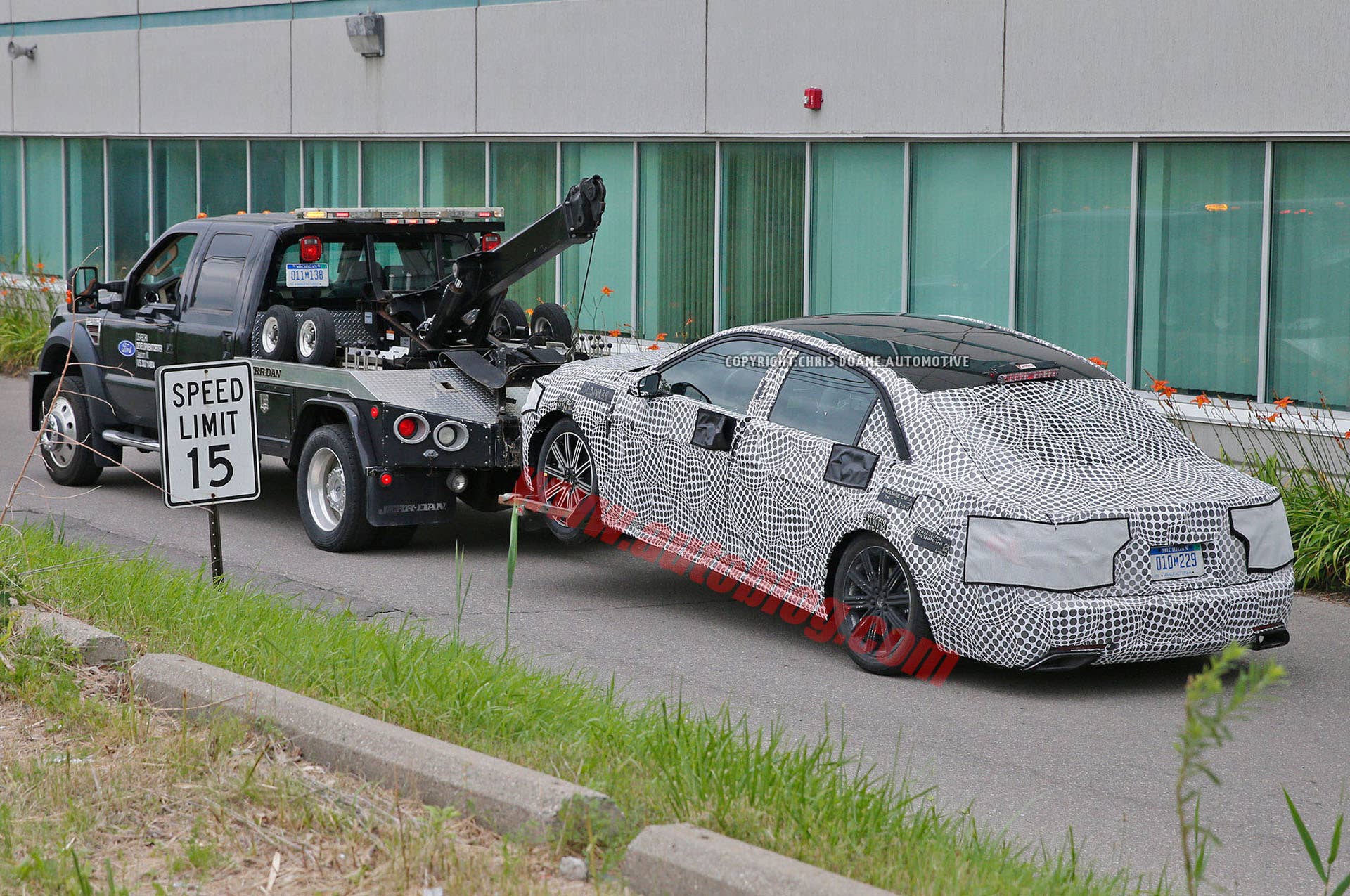 camouflage lincoln continental spy photo tow truck