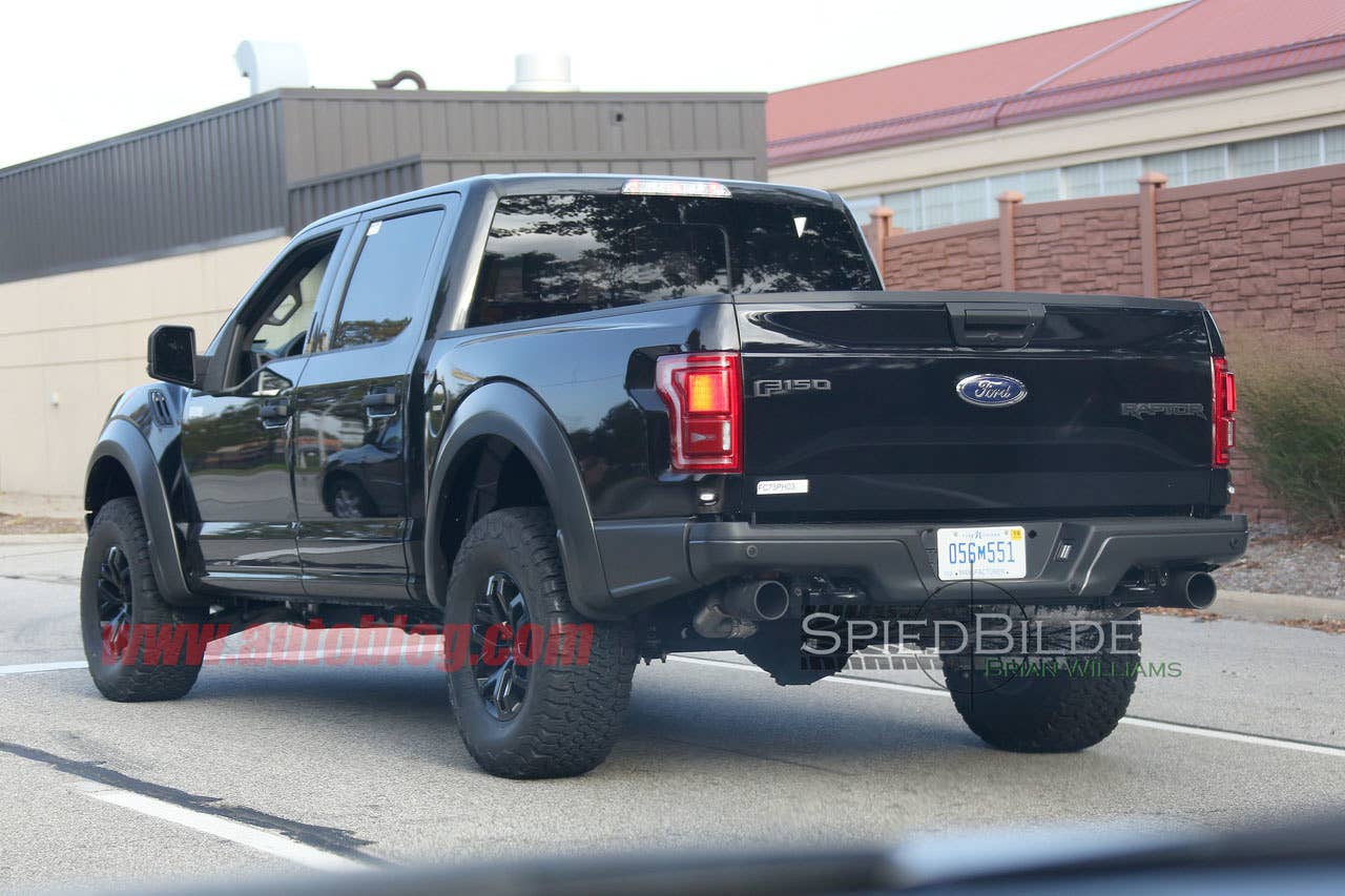 black 2017 ford f-150 raptor spy shot crew cab rear three quarters
