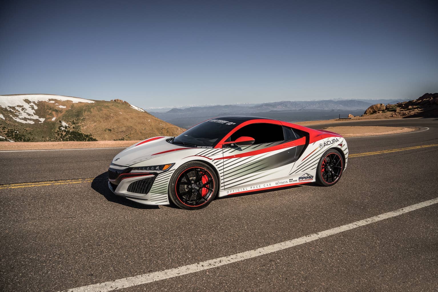 The new Acura NSX leads the pack as the the pace car for the 2015 Pikes Peak International Hill Climb