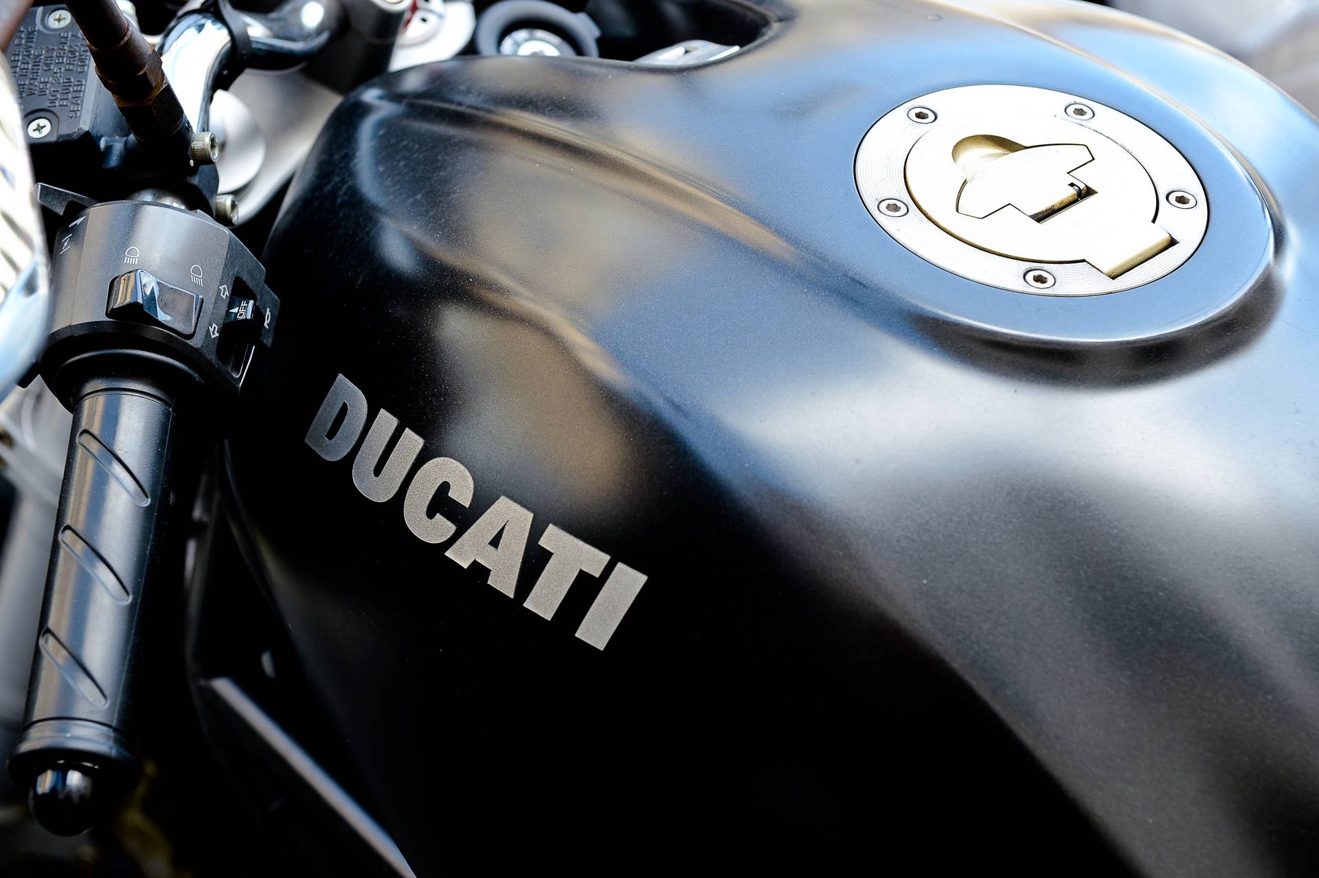 A Ducati Moster motorbike is seen in a parking in dountown Rome on, April 18, 2012. Volkswagen's Audi business mark has agreed the next days to buy the Italian motorcycle maker Ducati for about 860 million euros ($1.12 billion) including debt. AFP PHOTO / ANDREAS SOLARO (Photo credit should read ANDREAS SOLARO/AFP/Getty Images)