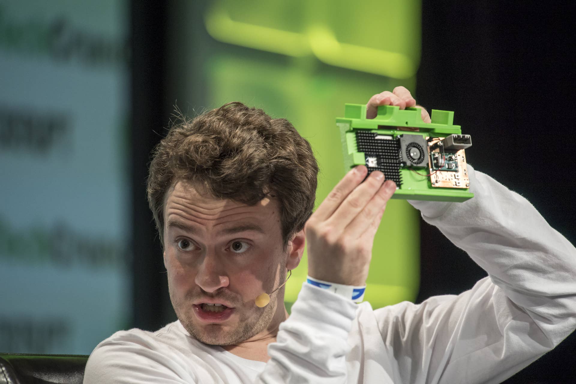 George Hotz, co-founder and chief executive officer at Comma.ai, holds the Comma One Self Driving device as he speaks during the TechCrunch Disrupt San Francisco 2016 Summit in San Francisco, California, U.S., on Tuesday, Sept. 13, 2016. TechCrunch Disrupt, the world's leading authority in debuting revolutionary startups, gathers the brightest entrepreneurs, investors, hackers, and tech fans for on-stage interviews. Photographer: David Paul Morris/Bloomberg via Getty Images