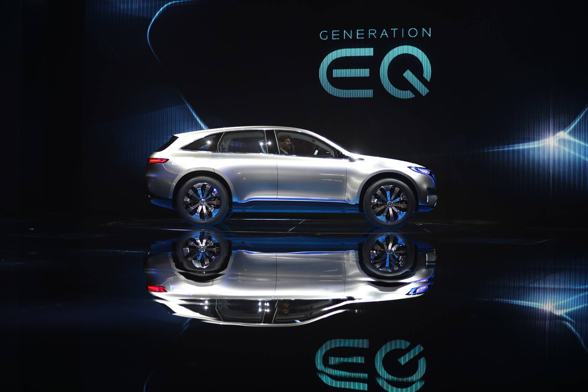 The new Mercedes-Benz Generation EQ electric concept sport-utility vehicle (SUV) drives on stage on the first press day of the Paris Motor Show at Porte de Versailles exhibition center in Paris, France, on Thursday, Sept. 29, 2016. Ford Motor Co. and Rolls-Royce are among the companies skipping the car show, also known as Mondial de L'Automobile, as the once-unmissable event succumbs to changes sweeping the auto industry. Photographer: Jasper Juinen/Bloomberg via Getty Images
