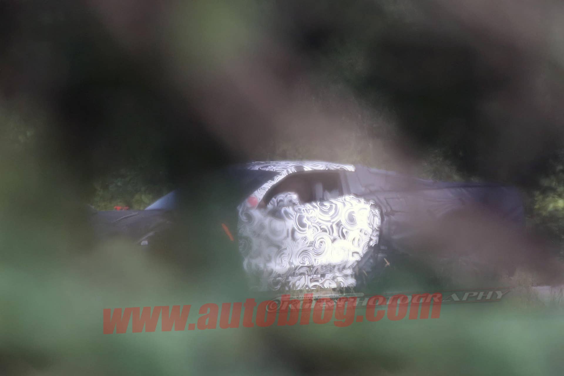 Mid-engine C8 Chevy Corvette spy shot profile