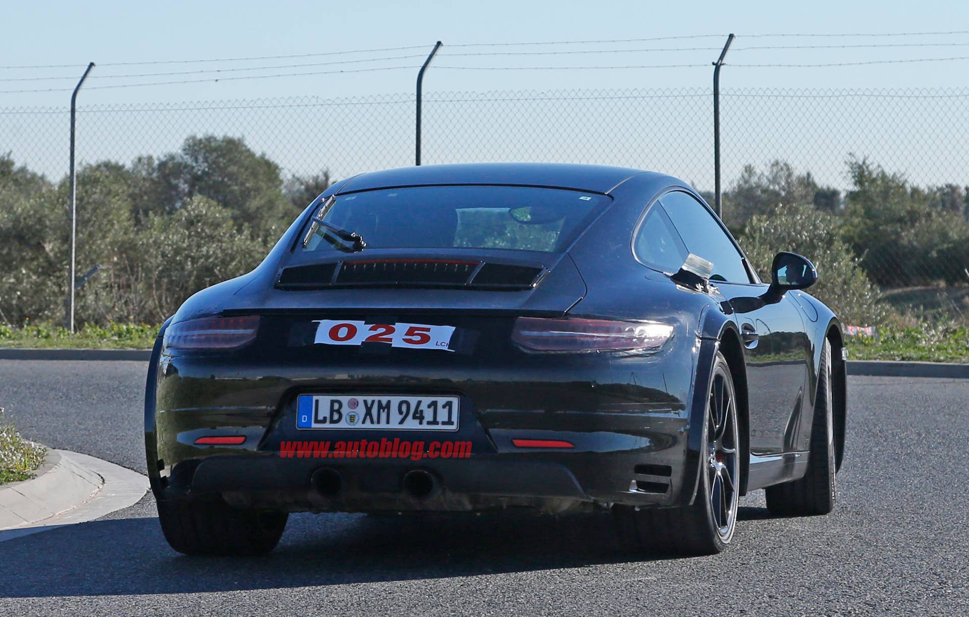 Spy shot of the next-generation 992-model Porsche 911 thought to hide a hybrid powertrain, rear.