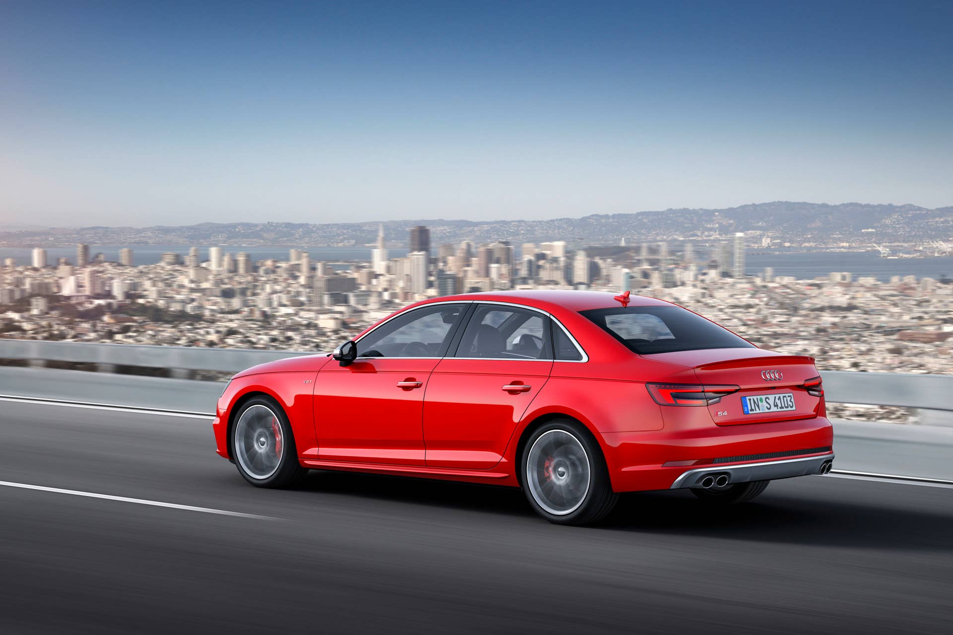 red 2017 audi s4 rear three quarters city
