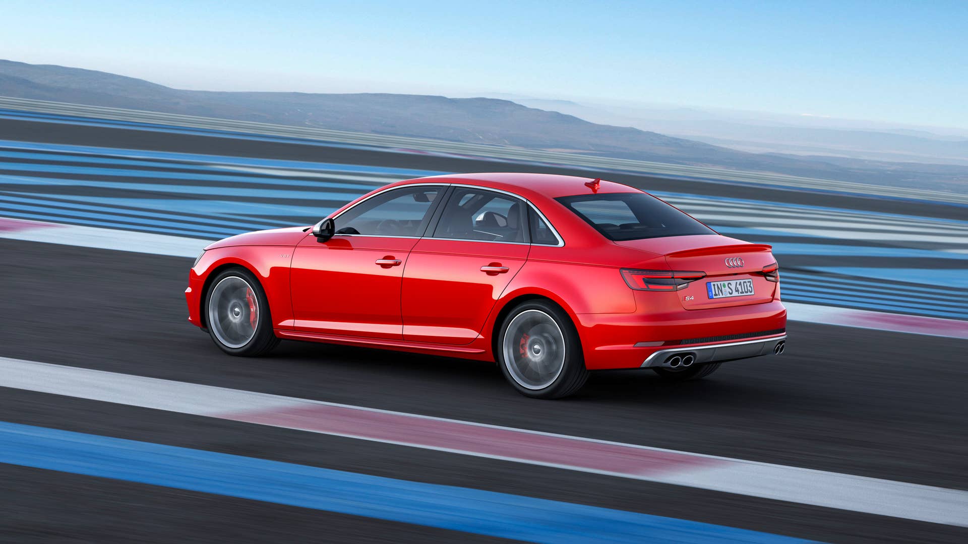 red 2017 audi s4 rear three quarters track
