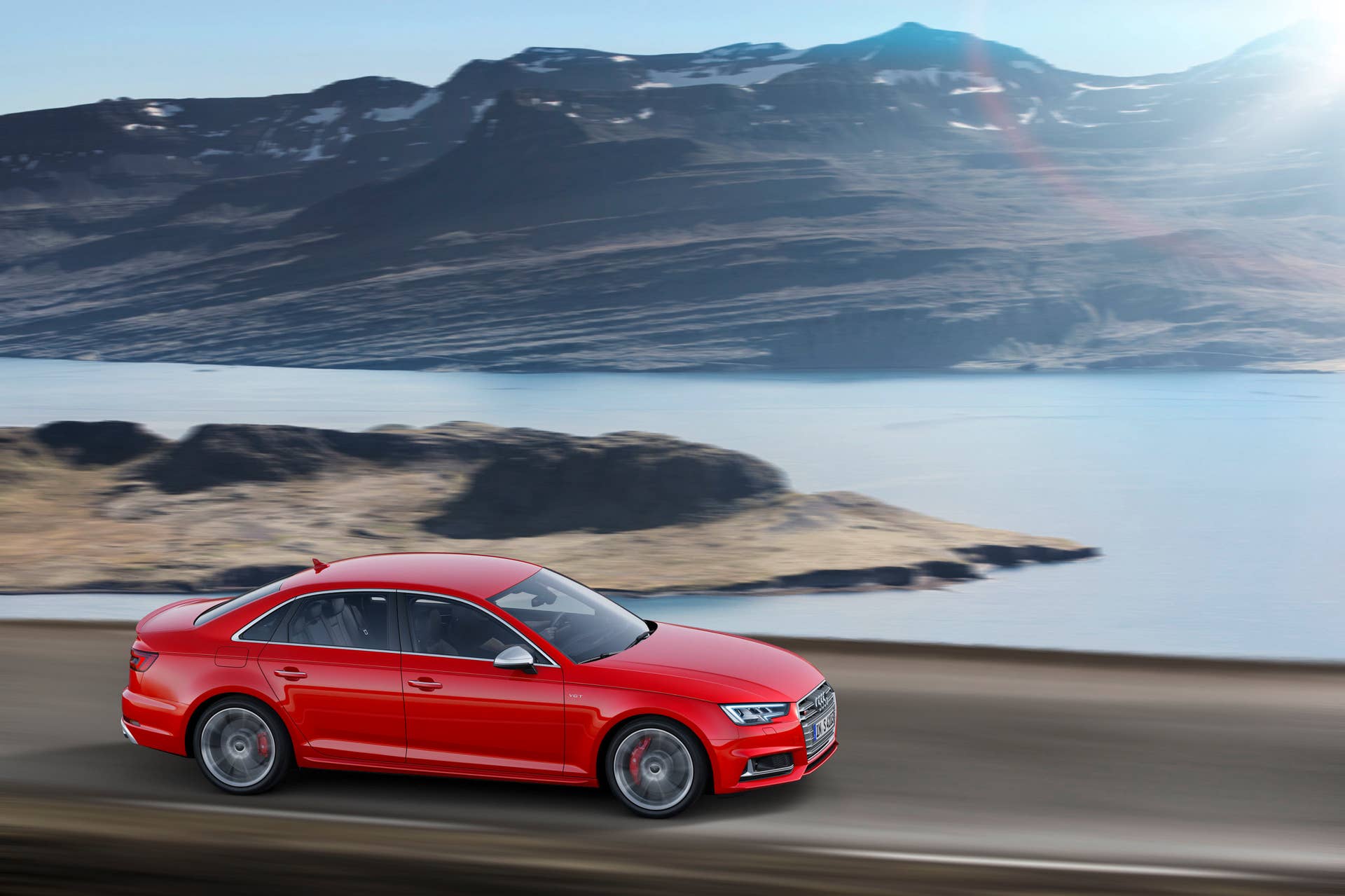 red 2017 audi s4 side on road