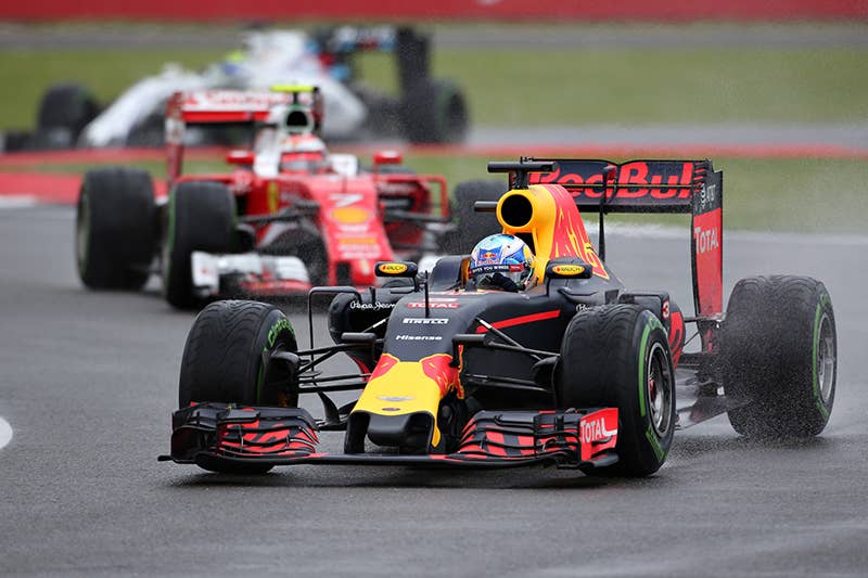 Daniel Ricciardo of Australia driving the (3) Red Bull Racing Red Bull-TAG Heuer RB12 TAG Heuer leads Kimi Raikkonen of Finland driving the (7) Scuderia Ferrari SF16-H Ferrari 059/5 turbo (Shell GP) on track during the Formula One Grand Prix of Great Britain at Silverstone on July 10, 2016 in Northampton, England.