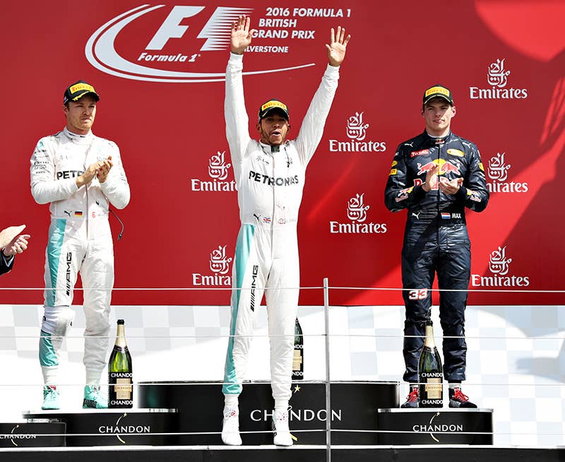 Lewis Hamilton of Great Britain and Mercedes GP celebrates his win on the podium with Nico Rosberg of Germany and Mercedes GP and Max Verstappen of Netherlands and Red Bull Racing during the Formula One Grand Prix of Great Britain at Silverstone on July 10, 2016 in Northampton, England.