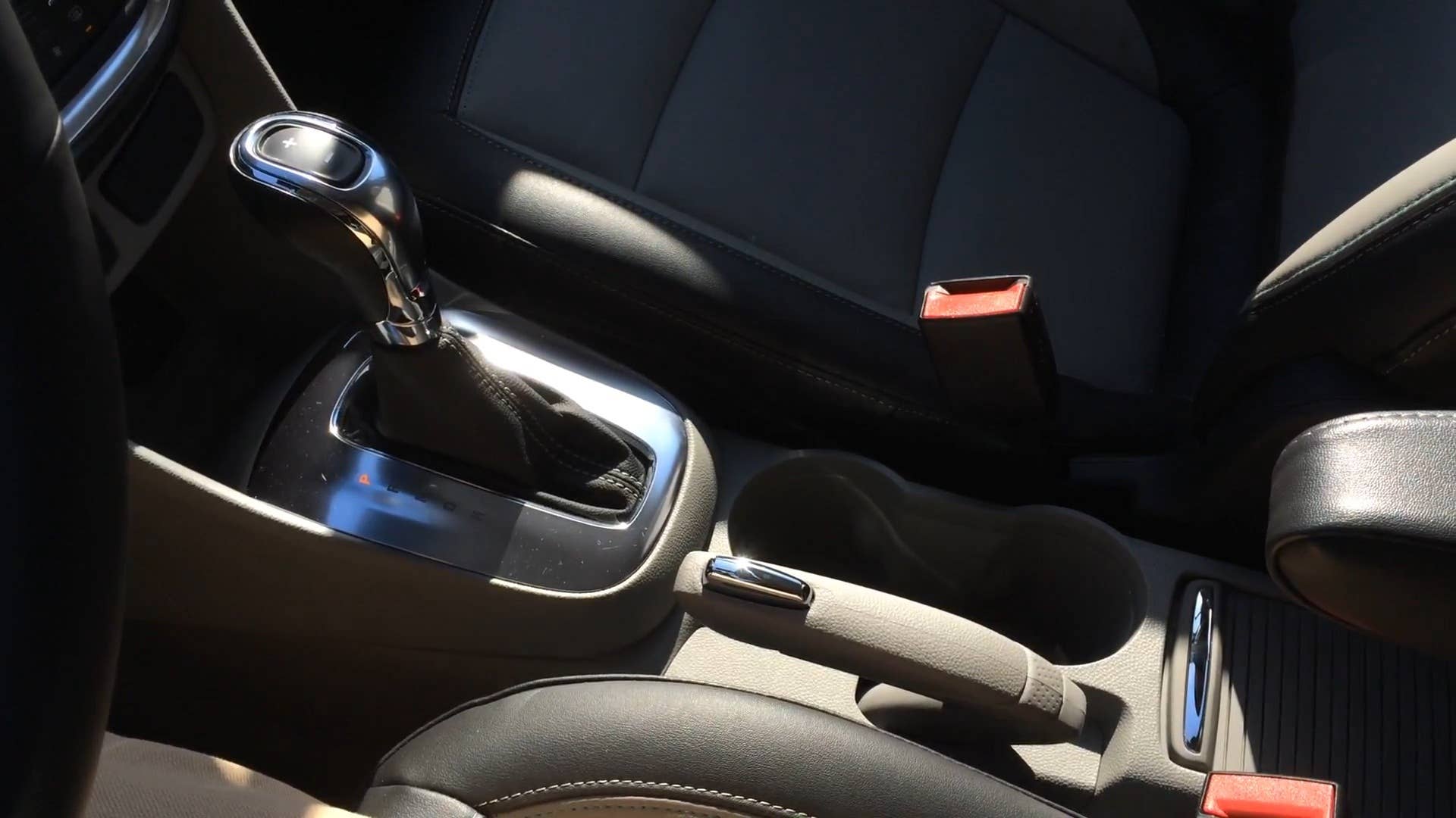 Autoblog's Adam Morath demonstrates the unique parking brake on the 2015 Buick Encore.