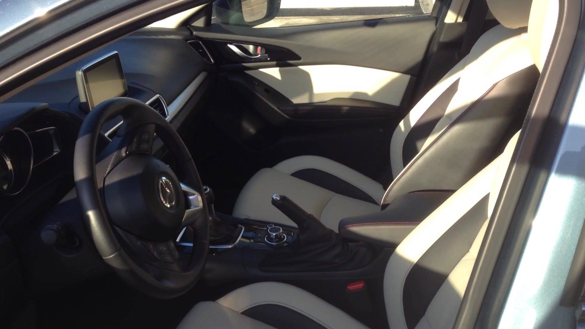 Autoblog senior editor Greg Migliore explains the interior features of the 2015 Mazda 3 S Grand Touring.