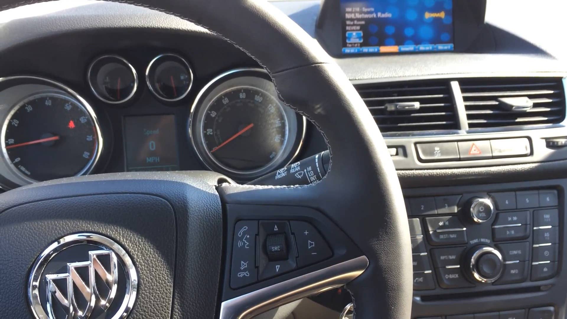 Autoblog's Adam Morath demonstrates the IntelliLink voice command system on the 2015 Buick Encore by changing the radio station with wheel-mounted controls and voice commands.