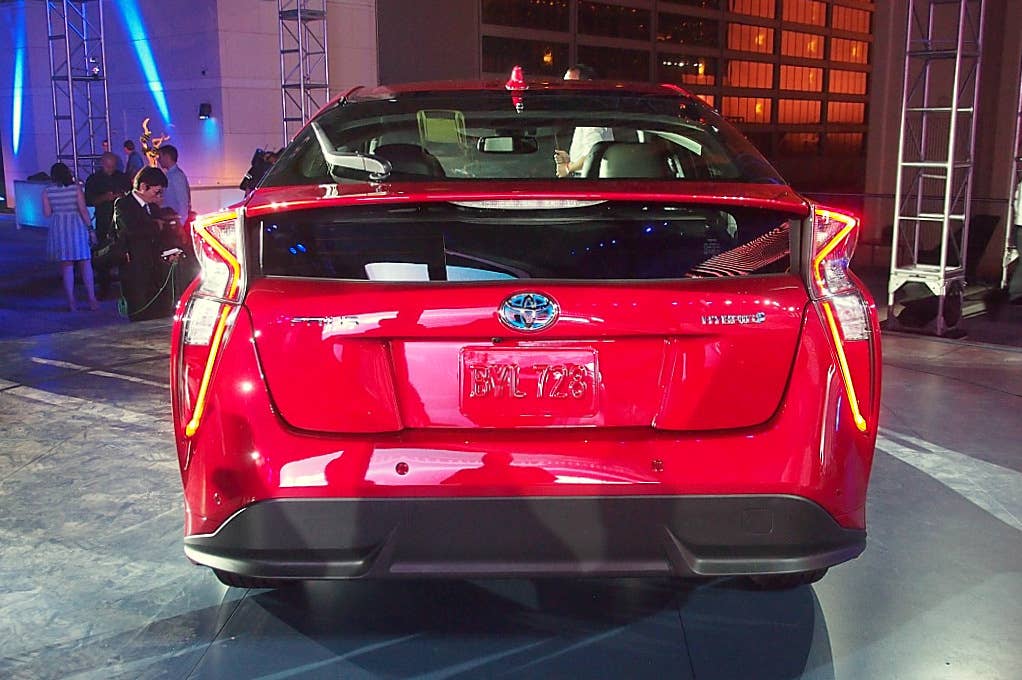2016 Toyota Prius red, at reveal event, rear view