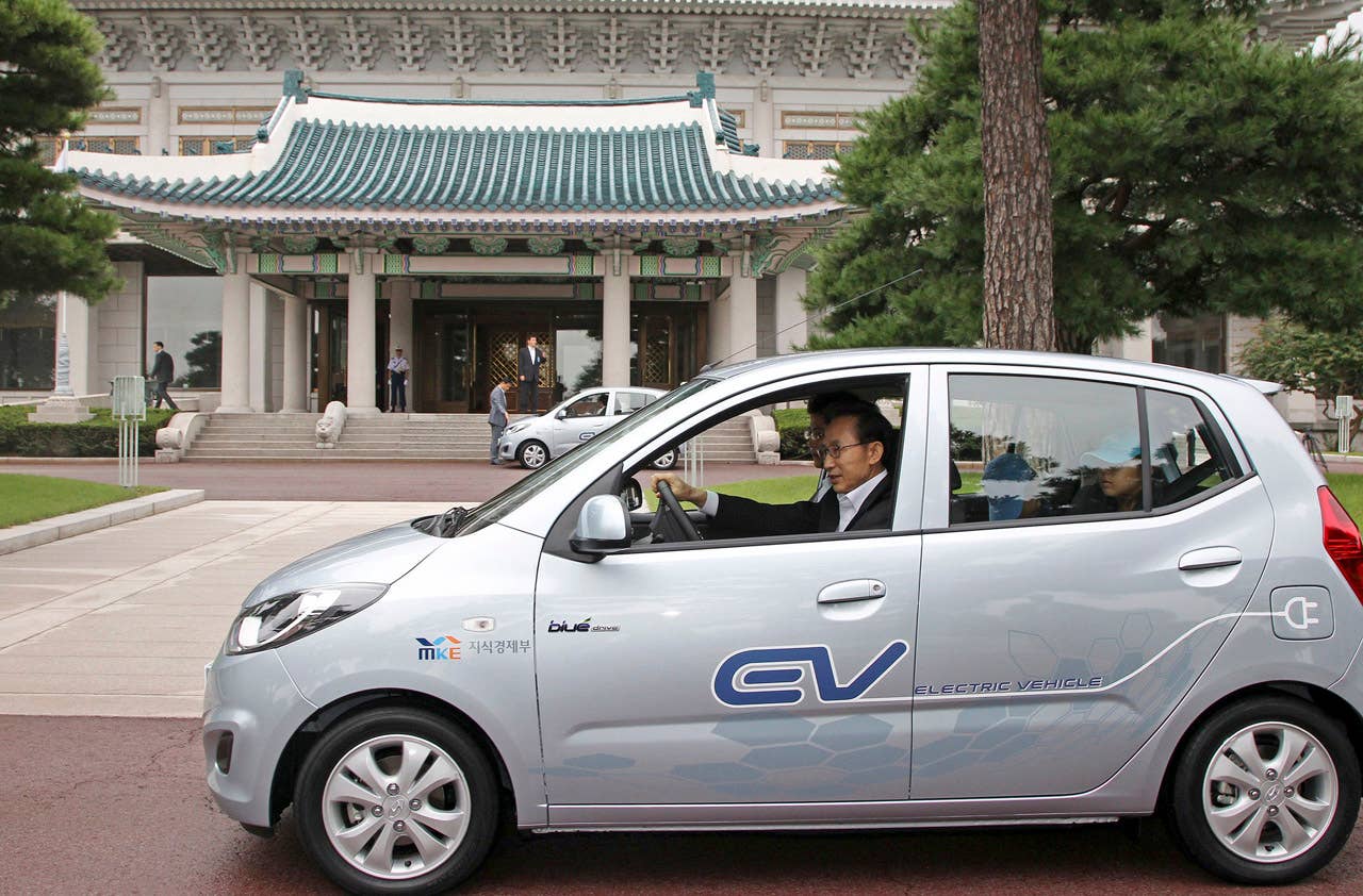 South Korean President Lee Myung-bak test dirves Hyundai's electric vehicle, BlueOn, in the compound of the presidential house in Seoul, South Korea, Thursday, Sept. 9, 2010. Hyundai Motor unveiled its first electric car Thursday as it moves to catch up with Japanese rivals that have jumped ahead in the field. (Photo credit: AP Photo/Yonhap, Chun Soo-young)