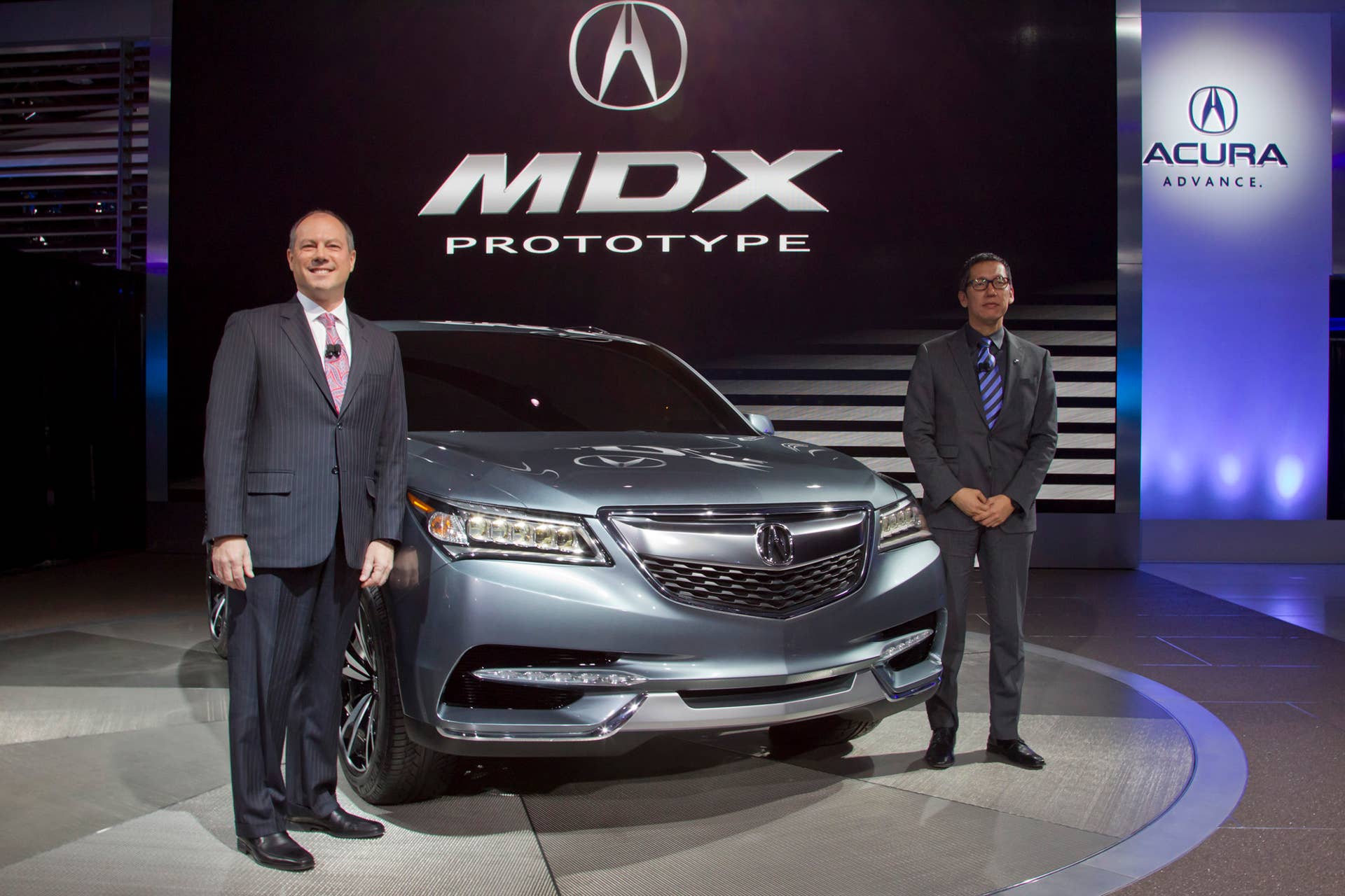 Mike Accavitti, Vice President of National Marketing Operations at Acura, and Jon Ikeda, Chief Designer of Acura Design Studio, at the 2013 Detroit Auto Show.