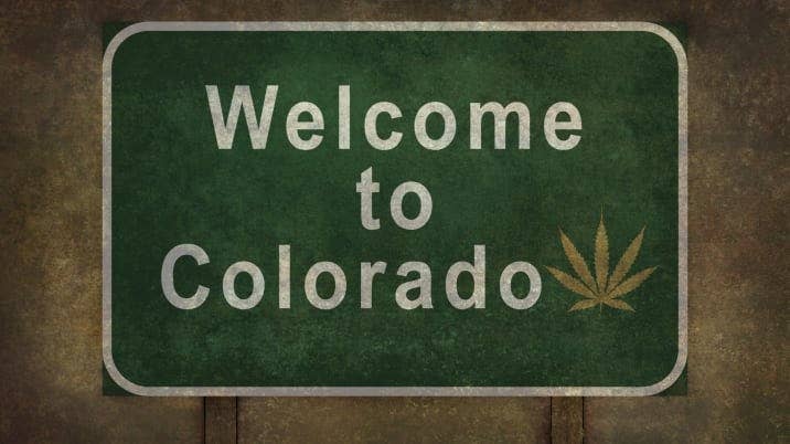 Welcome to Colorado (with marijuana leaf symbol) roadside sign