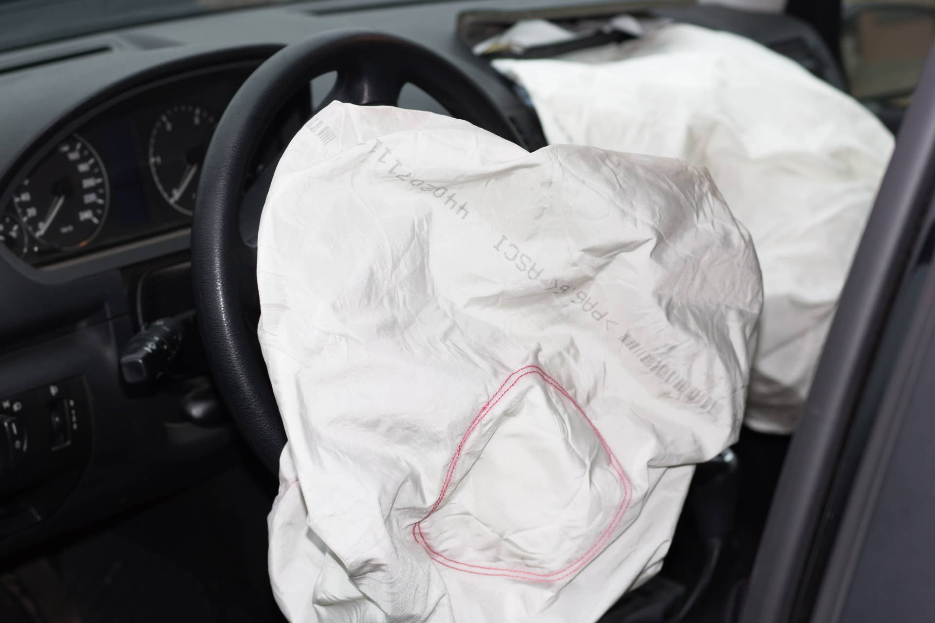 deflated airbags after the erupted inflation due to a car collision
