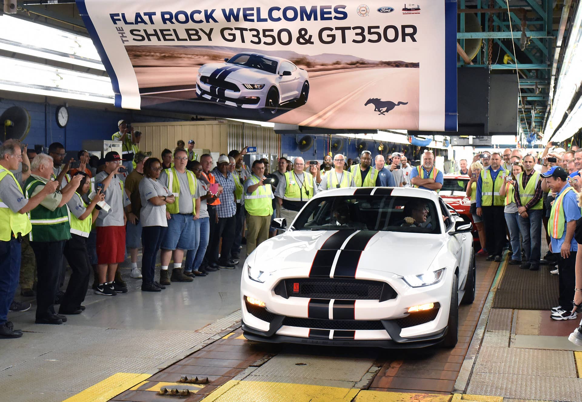 FLAT ROCK, MI., August 20, 2015--Bill Ford, executive chairman (driving) and Jimmy Settles, UAW vice president and director, National Ford Department,.drives the first all-new Ford Shelby(r) GT350R today at Ford's Flat Rock Assembly Plant. The new GT350R Mustang is the most athletic Mustang ever, designed to tackle the world's most challenging roads and race tracks while creating an exhilarating experience for the driver. Photo by: Sam VarnHagen