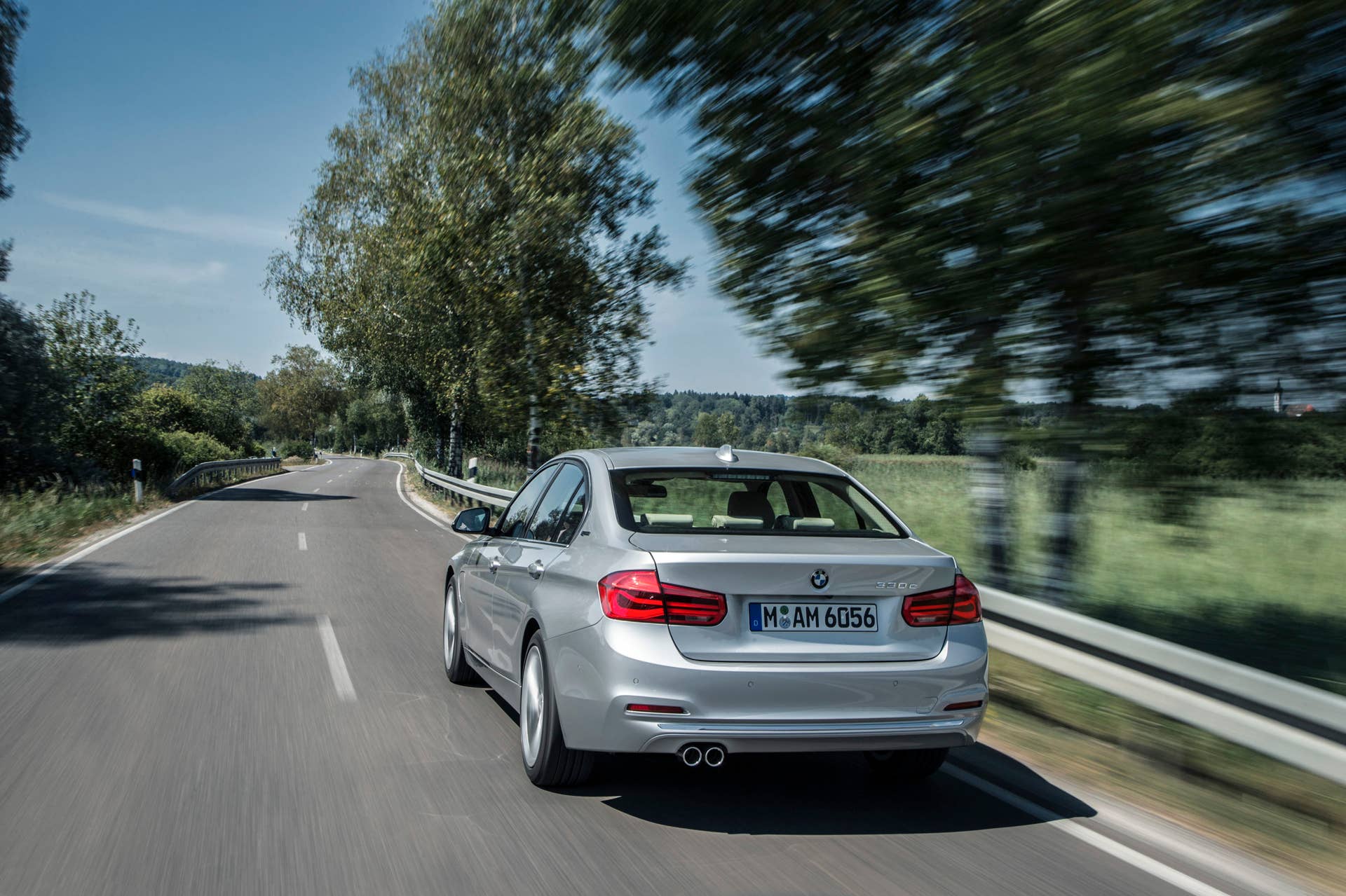 bmw 330e rear two-lane road