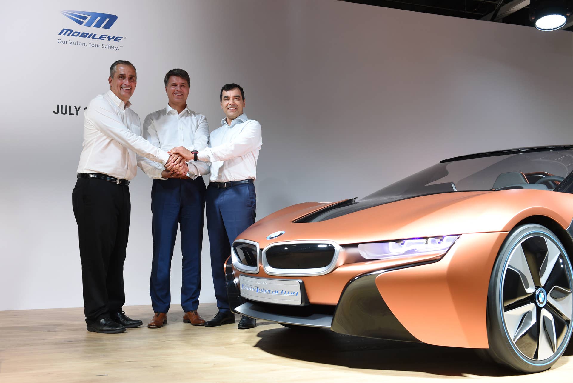 (L-R) Brian Krzanich, CEO of Intel, Harald Krueger, CEO of German car maker BMW and Amnon Shashua, co-founder, chairman and CTO Mobileye NV, pose after a press conference in Munich, southern Germany, on July 1, 2016. The BMW Group, Intel and Mobileye, the three leaders from automotive, technology and computer vision and machine learning industries are collaborating to bring solutions for highly and fully automated driving into series production by 2021. / AFP / CHRISTOF STACHE (Photo credit should read CHRISTOF STACHE/AFP/Getty Images)