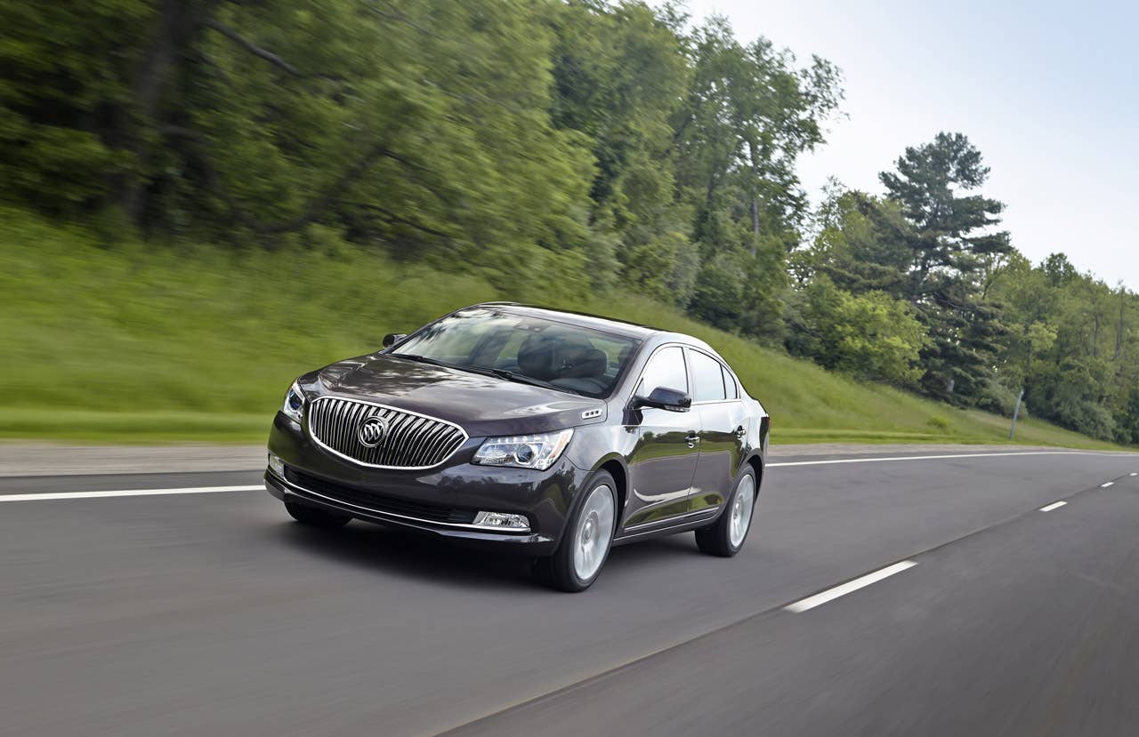 2014 Buick LaCrosse 1SL AWD with Midnight Amethyst Metallic exterior color and 19 Alloy Wheels. Driving  front view