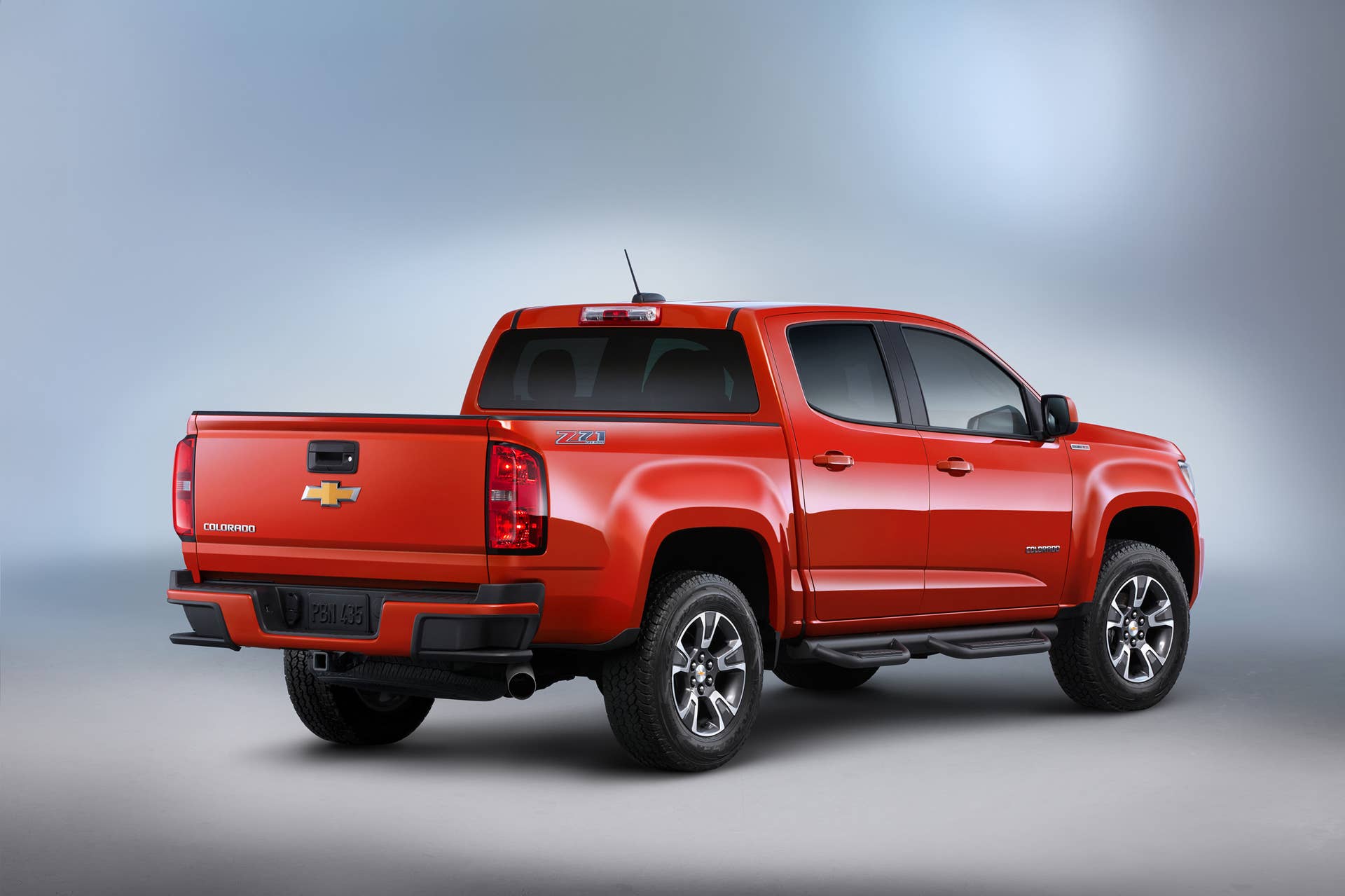 red 2016 chevy colorado duramax rear three quarters studio