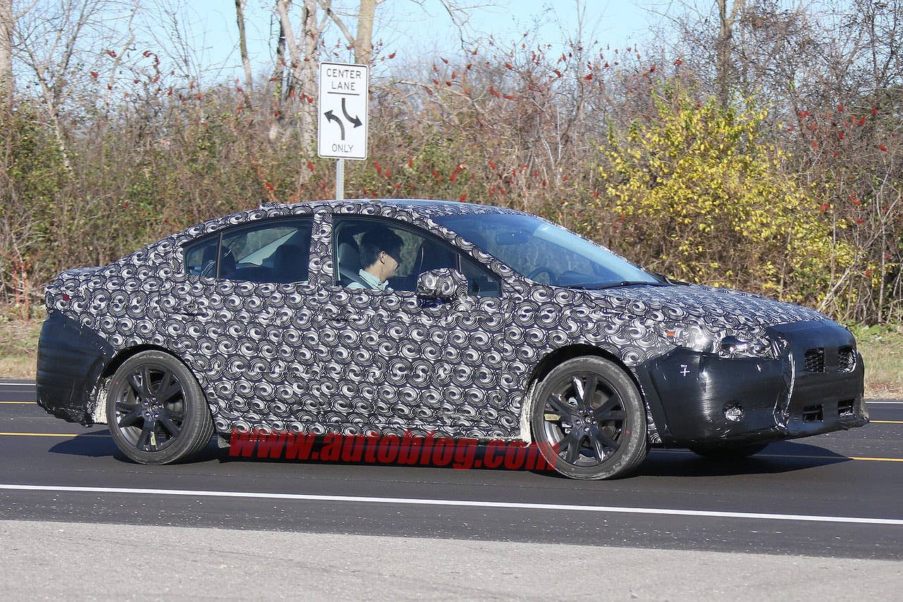 camouflaged 2017 subaru impreza spy shots side