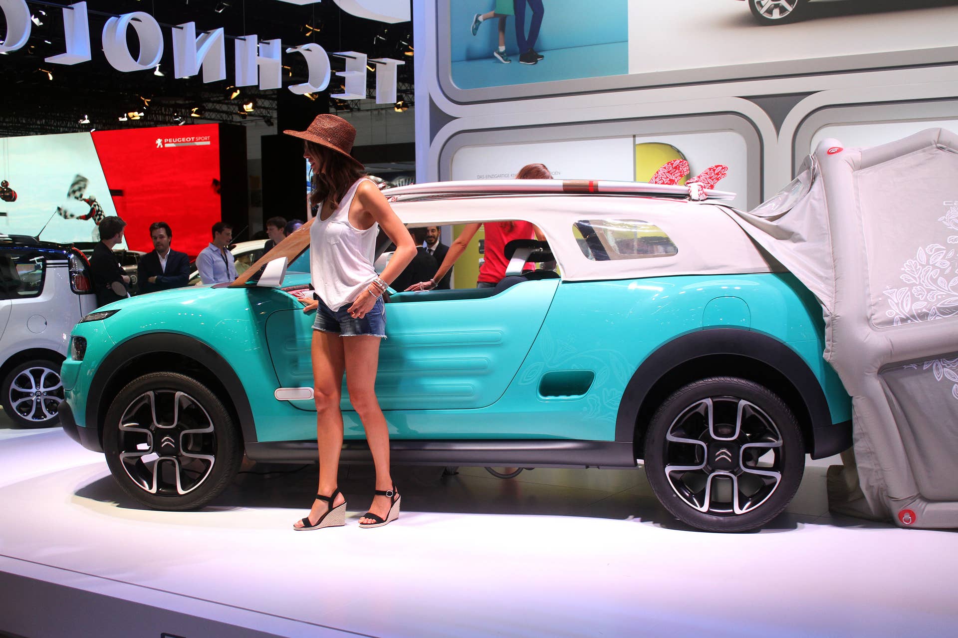 The Citroen Cactus M Concept at the 2015 Frankfurt Motor Show, side view, with model.