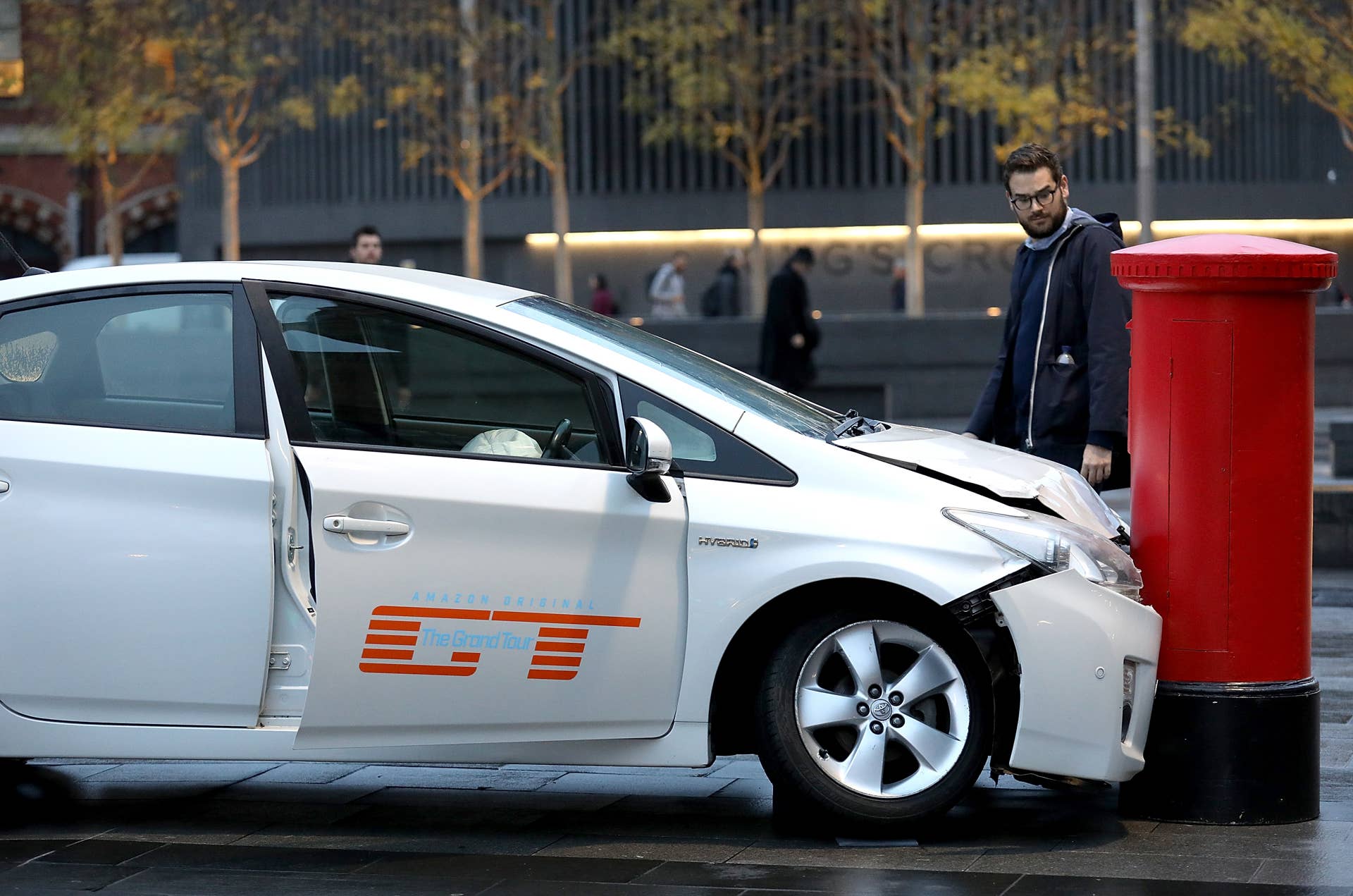LONDON, UNITED KINGDOM - NOVEMBER 15: A car 'crashed' into a post box outside King's Cross Station in London, United Kingdom on November 15, 2016, ahead of the launch of Jeremy Clarkson, Richard Hammond and James May's new show, 'The Grand Tour', on Amazon Prime Video, on Friday. (Photo by Tim P. Whitby/Getty Images for Amazon Prime Video)