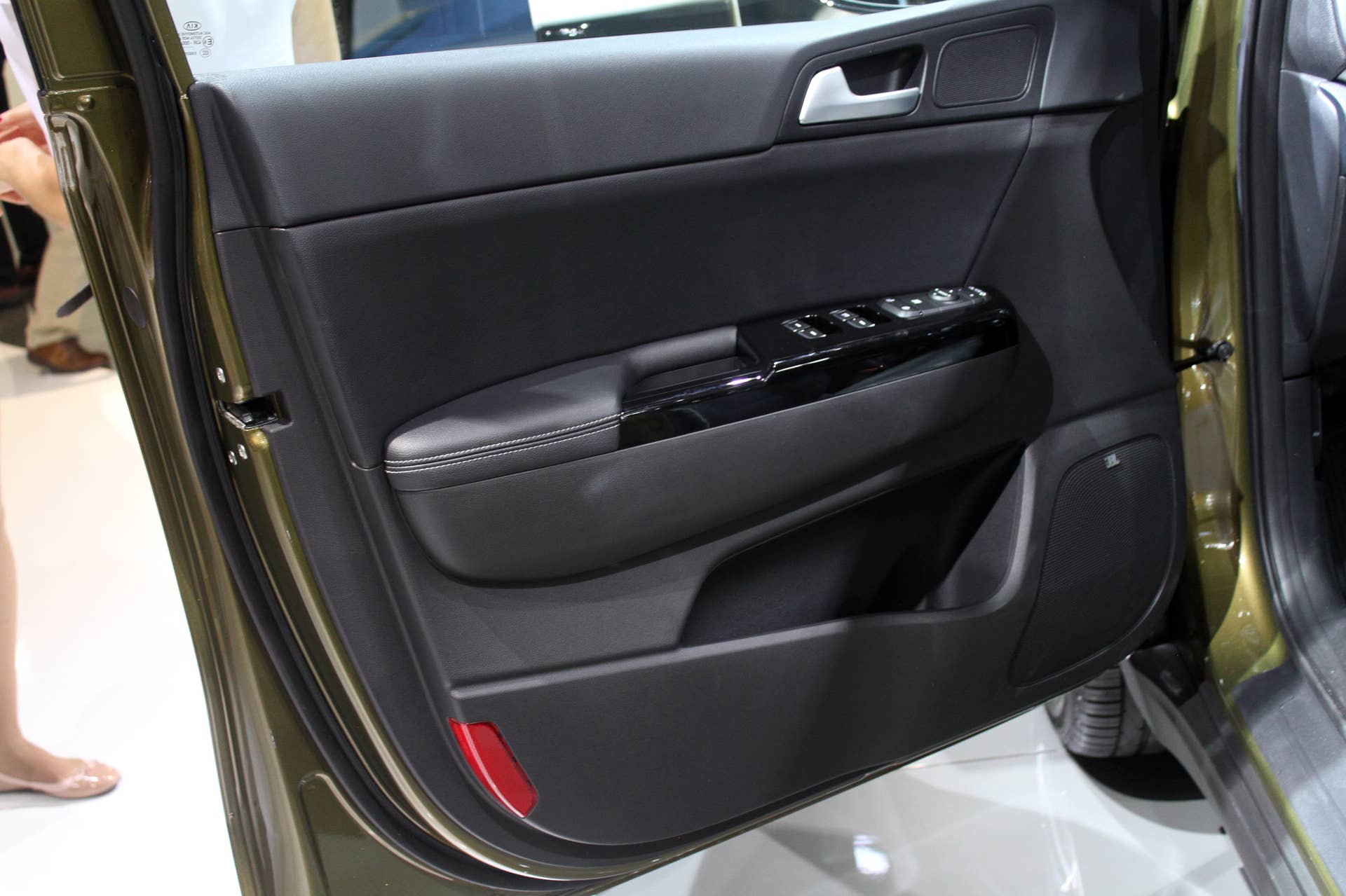 The 2016 Kia Sportage, revealed at the 2015 Frankfurt Motor Show, driver's door panel.