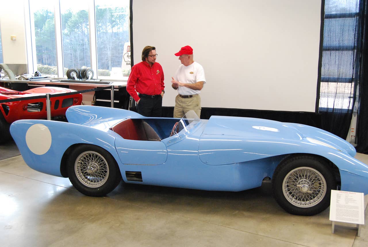 Barber Vintage Motorsports Museum lead auto restoration technician John Viviani, left, talks to Robert Kahmer. With input from Kahmer, Viviani restored the 1955 Lotus Mark X Kahmer once owned and raced.