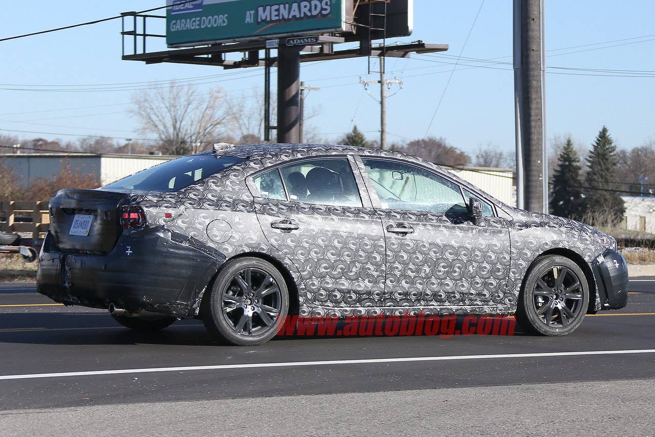 camouflaged 2017 subaru impreza spy shots rear side