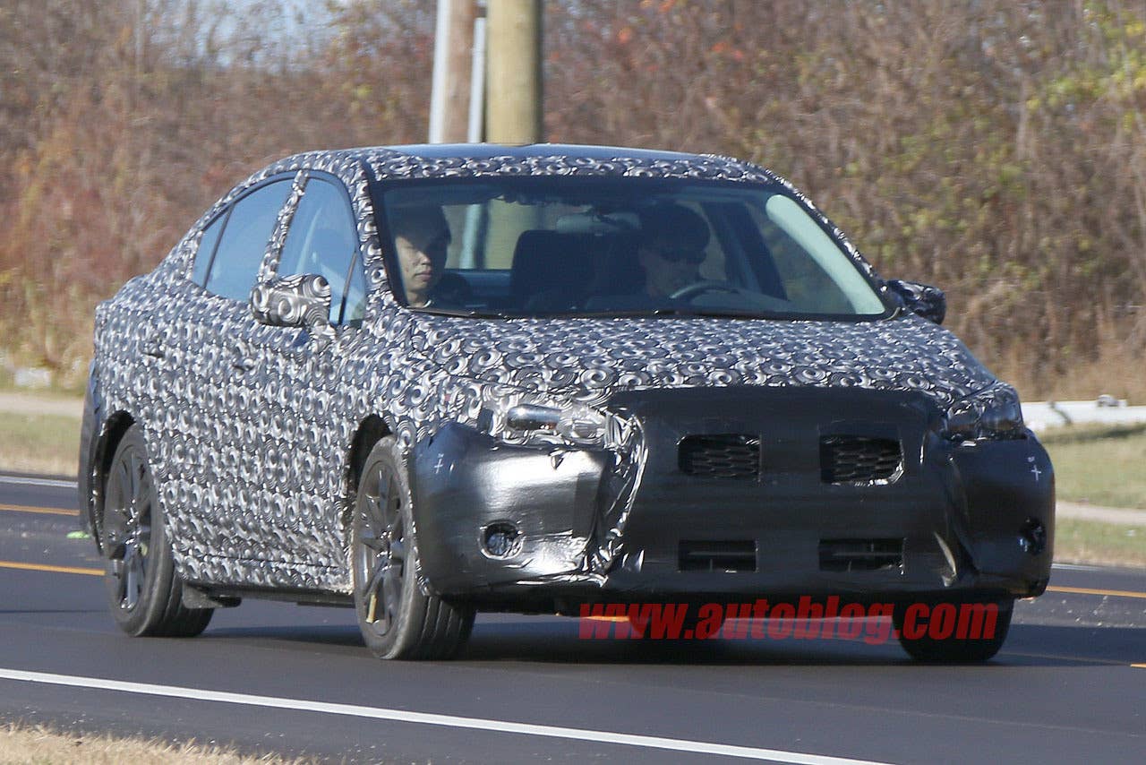 camouflaged 2017 subaru impreza spy shots front three quarters