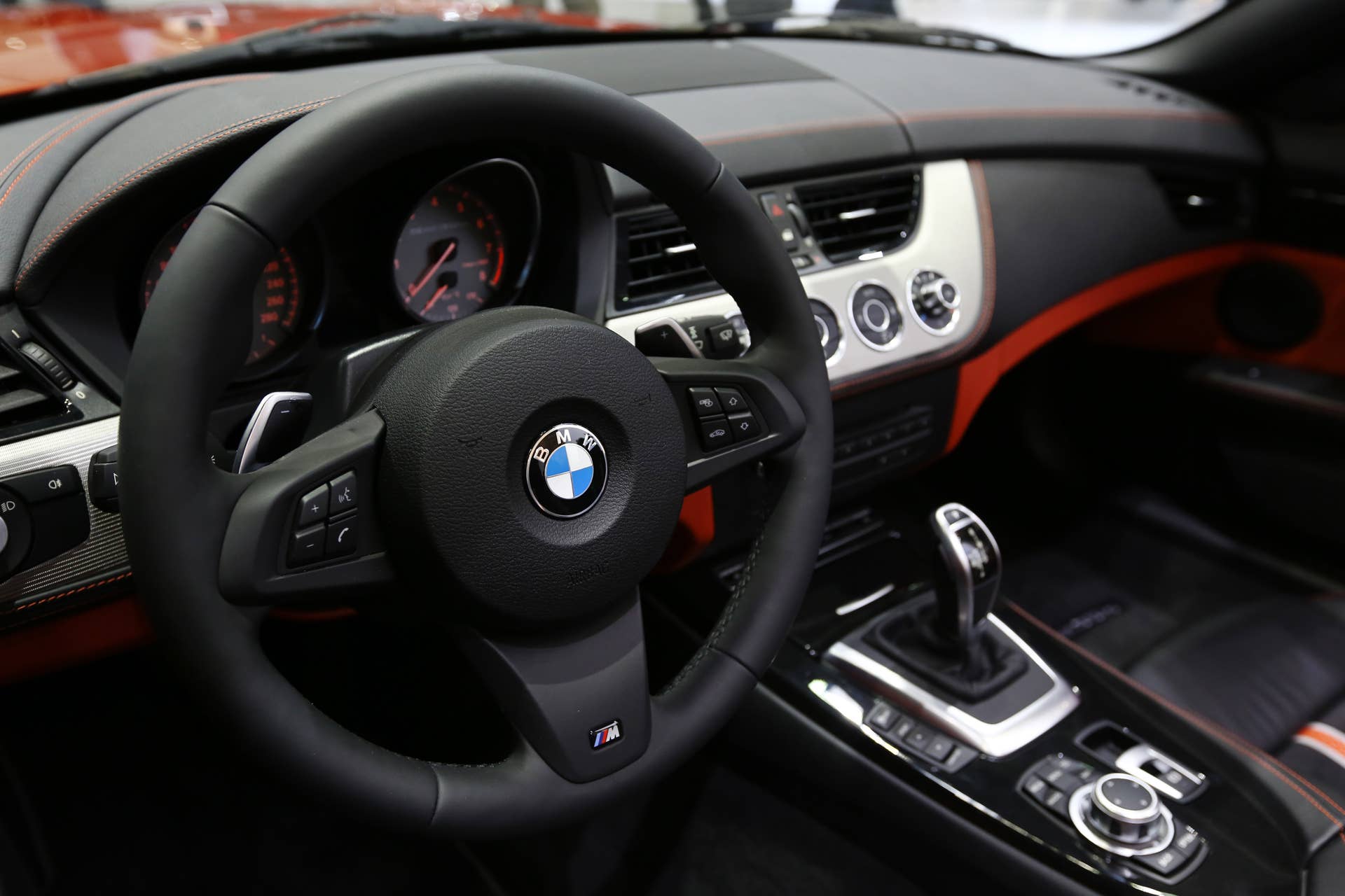The Bayerische Motoren Werke AG (BMW) logo is displayed on the steering wheel of the company's z4 sDrive 35is vehicle during the press day of the Seoul Motor Show in Goyang, South Korea, on Thursday, March 28, 2013. The show runs from today until April 7. Photographer: SeongJoon Cho/Bloomberg via Getty Images