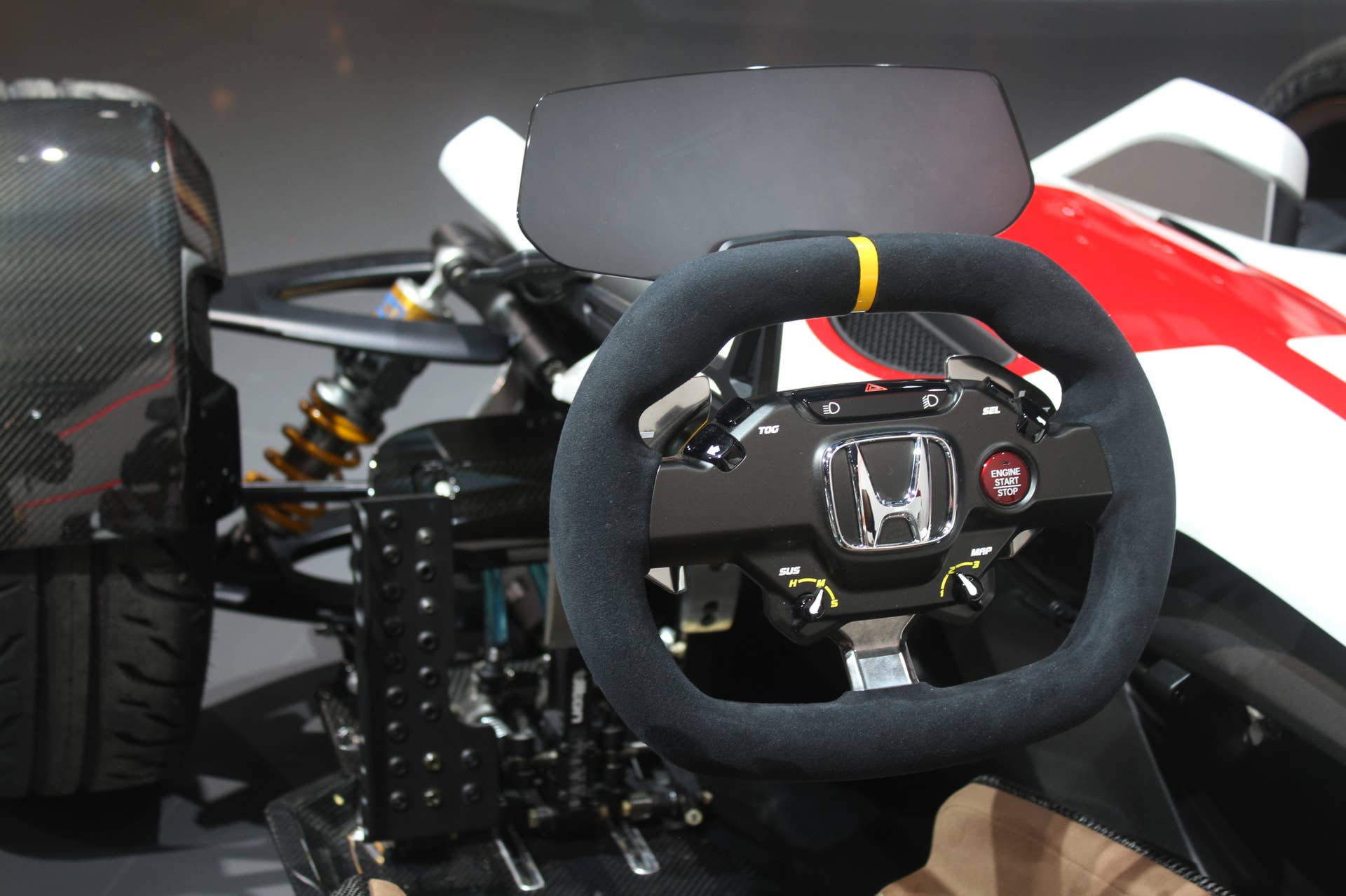 Honda Project 2  &  4 concept that combines the company's RC-213vs MotoGP bike with a car, at the 2015 Frankfurt Motor Show, steering wheel and instrument panel.