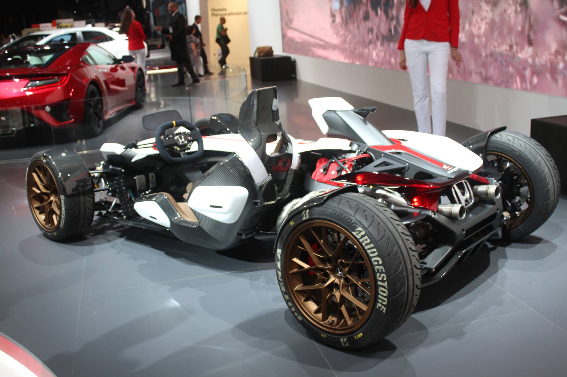 Honda Project 2  &  4 concept that combines the company's RC-213vs MotoGP bike with a car, at the 2015 Frankfurt Motor Show, rear three-quarter view.