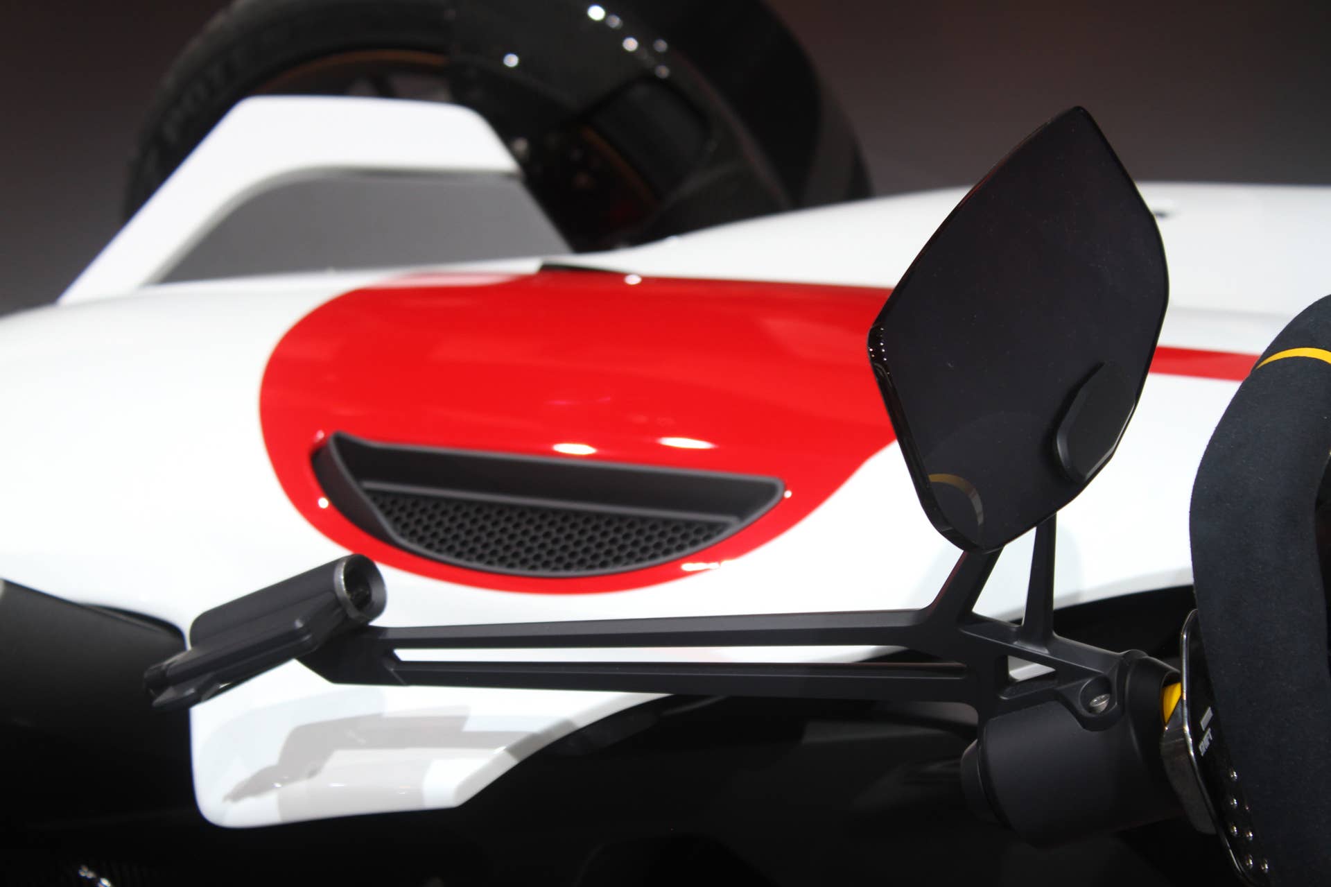 Honda Project 2  &  4 concept that combines the company's RC-213vs MotoGP bike with a car, at the 2015 Frankfurt Motor Show, instrument panel mechanism, with laser beam.