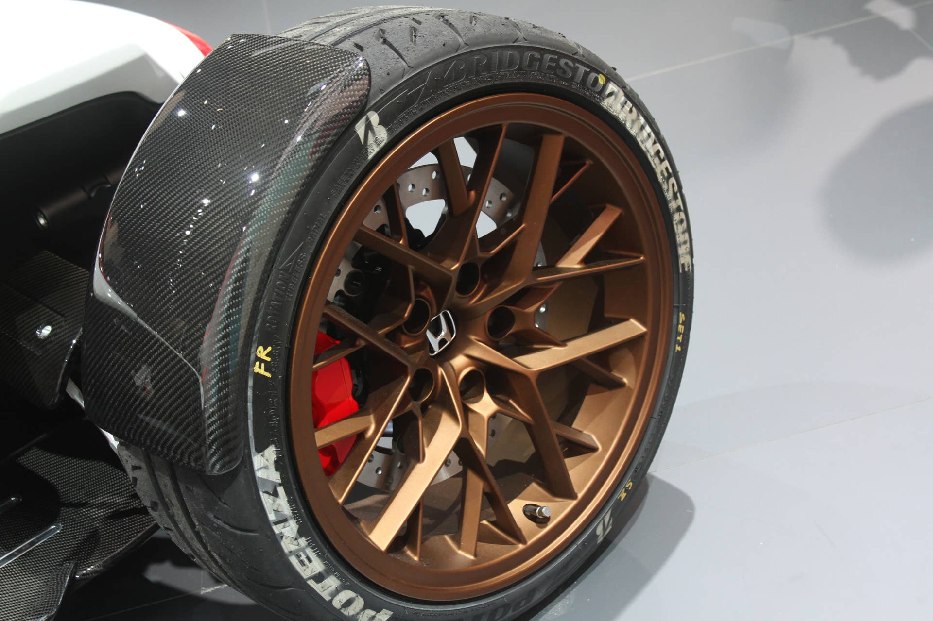 Honda Project 2  &  4 concept that combines the company's RC-213vs MotoGP bike with a car, at the 2015 Frankfurt Motor Show, wheel detail.