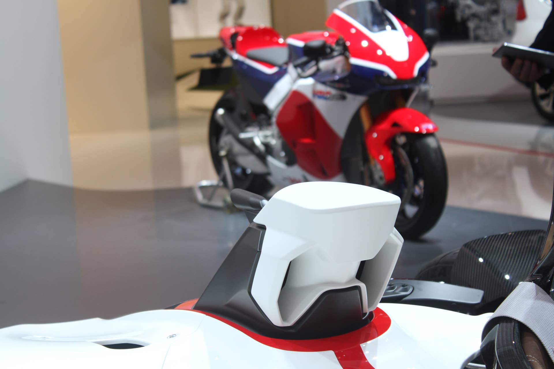 Honda Project 2 & 4 concept that combines the company's RC-213vs MotoGP bike with a car, at the 2015 Frankfurt Motor Show, air intake, with RC213-VS bike in the background.