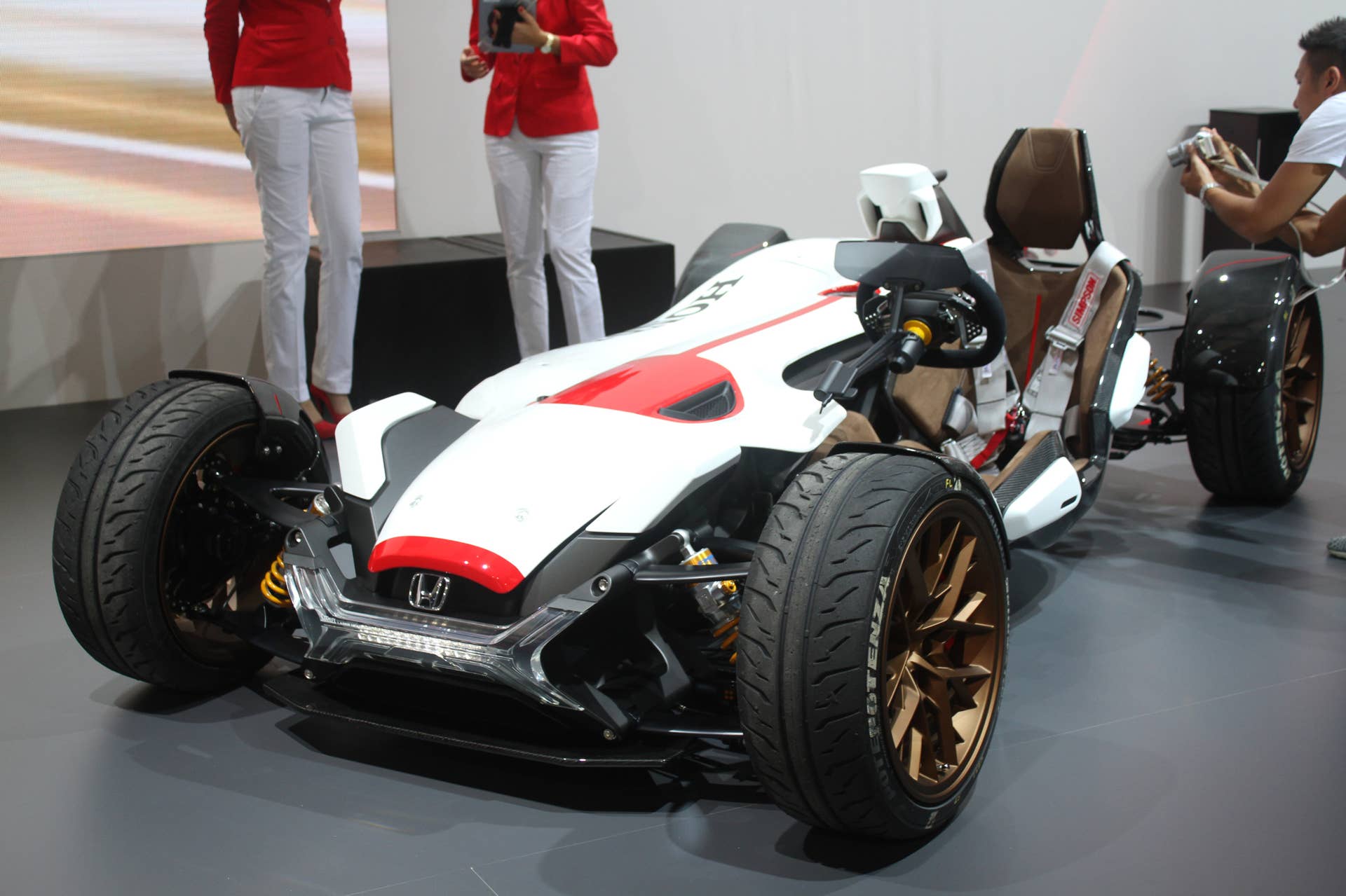 Honda Project 2  &  4 concept that combines the company's RC-213vs MotoGP bike with a car, at the 2015 Frankfurt Motor Show, front three-quarter view.