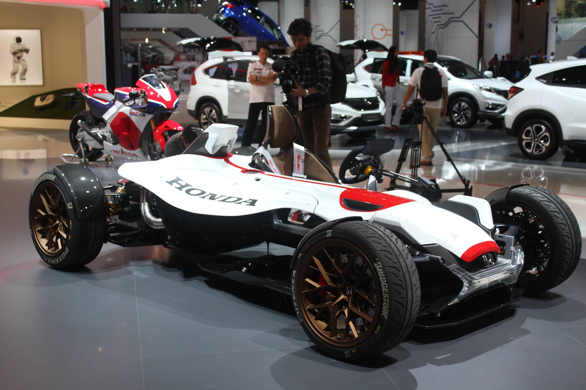Honda Project 2  &  4 concept that combines the company's RC-213vs MotoGP bike with a car, at the 2015 Frankfurt Motor Show, front three-quarter.