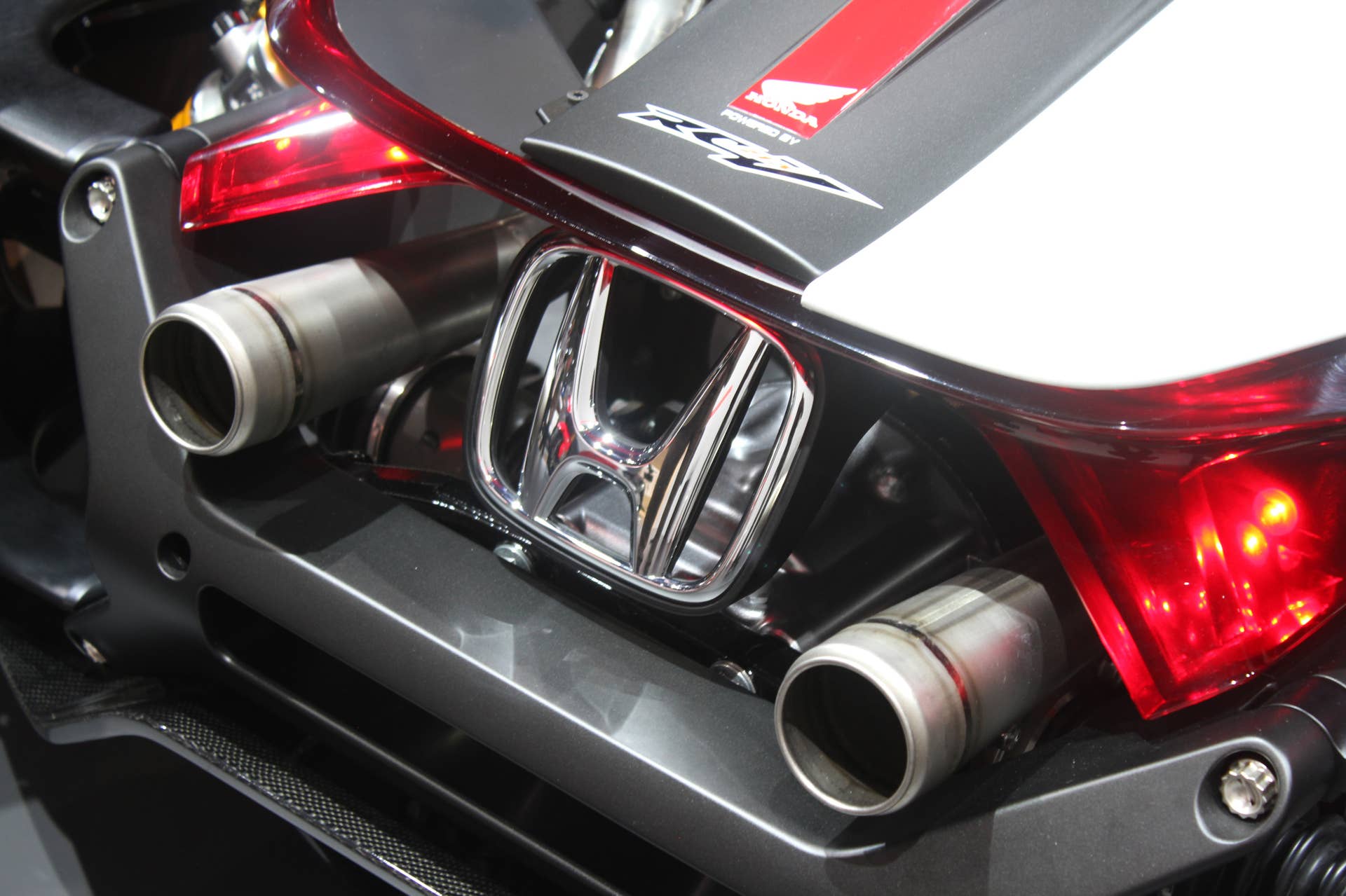 Honda Project 2  &  4 concept that combines the company's RC-213vs MotoGP bike with a car, at the 2015 Frankfurt Motor Show, exhaust detail.