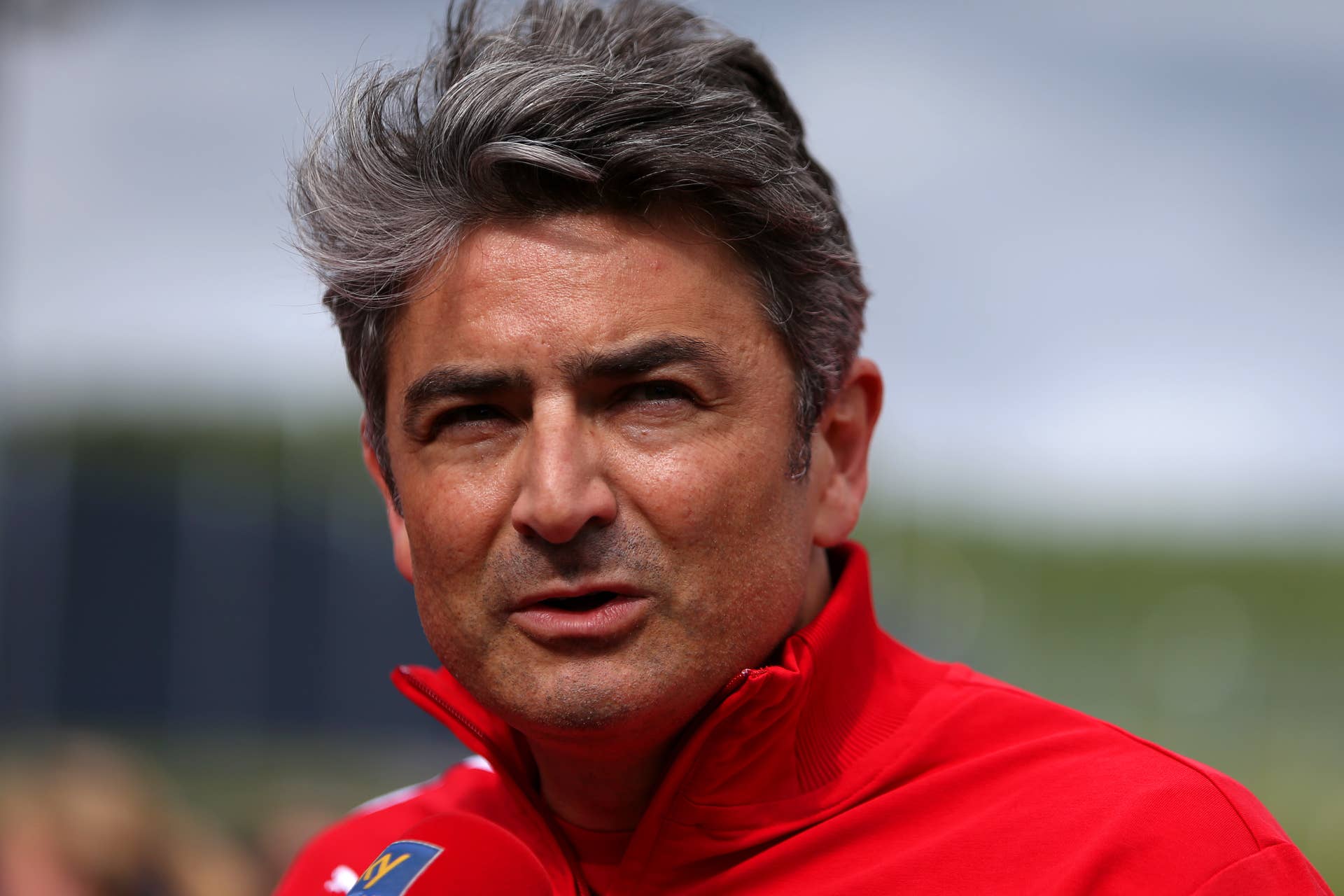 SPIELBERG, AUSTRIA - JUNE 20: Ferrari Team Principal Marco Mattiacci speaks with members of the press in the paddock during practice ahead of the Austrian Formula One Grand Prix at Red Bull Ring on June 20, 2014 in Spielberg, Austria. (Photo by Dom Romney/Getty Images)
