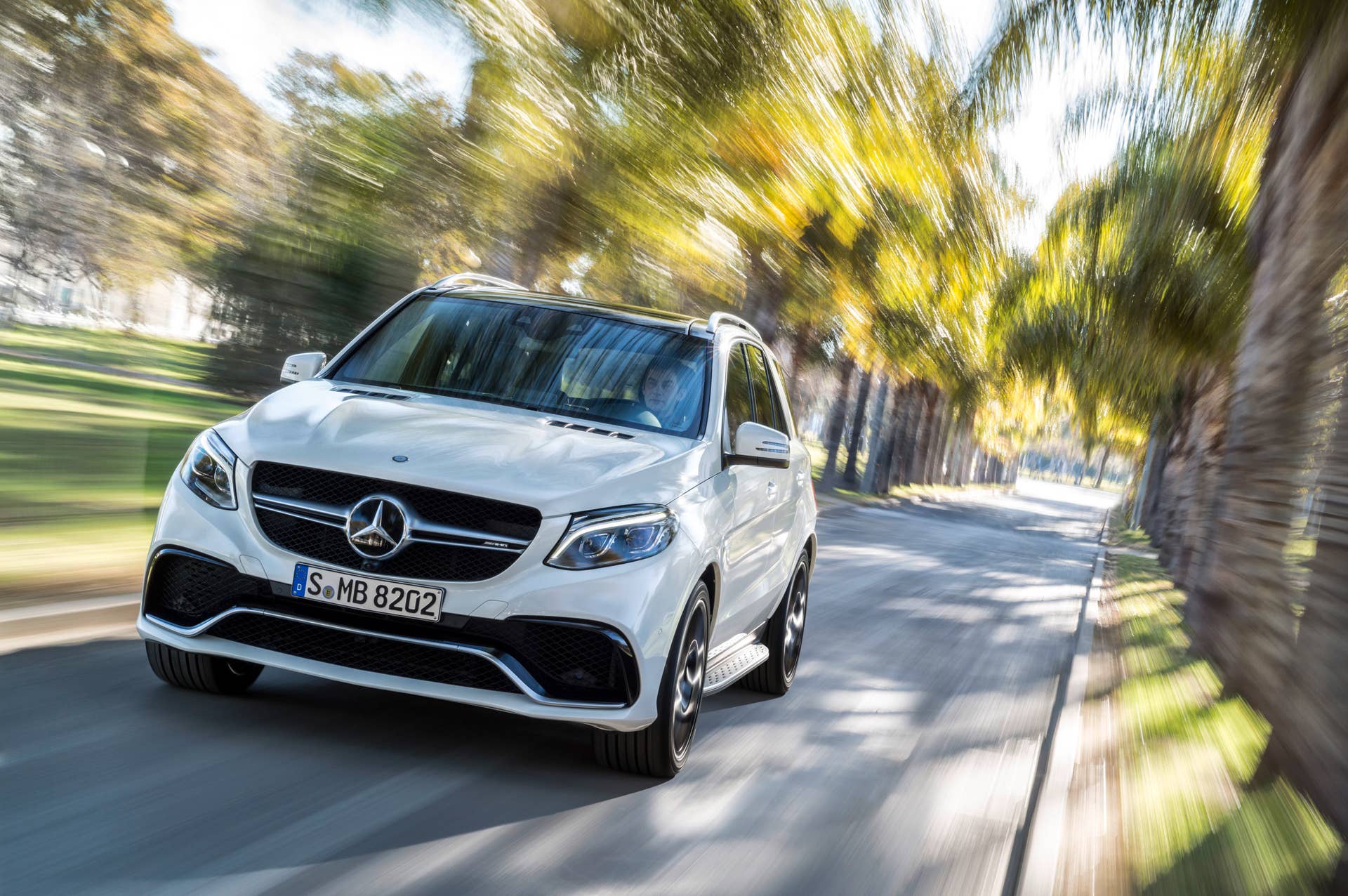white mercedes gle63 s front palm trees