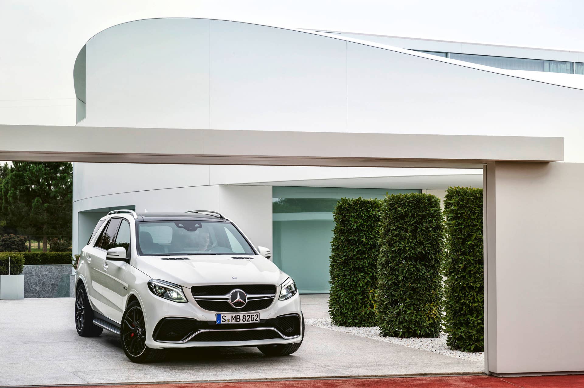 white mercedes gle63 s front modern house
