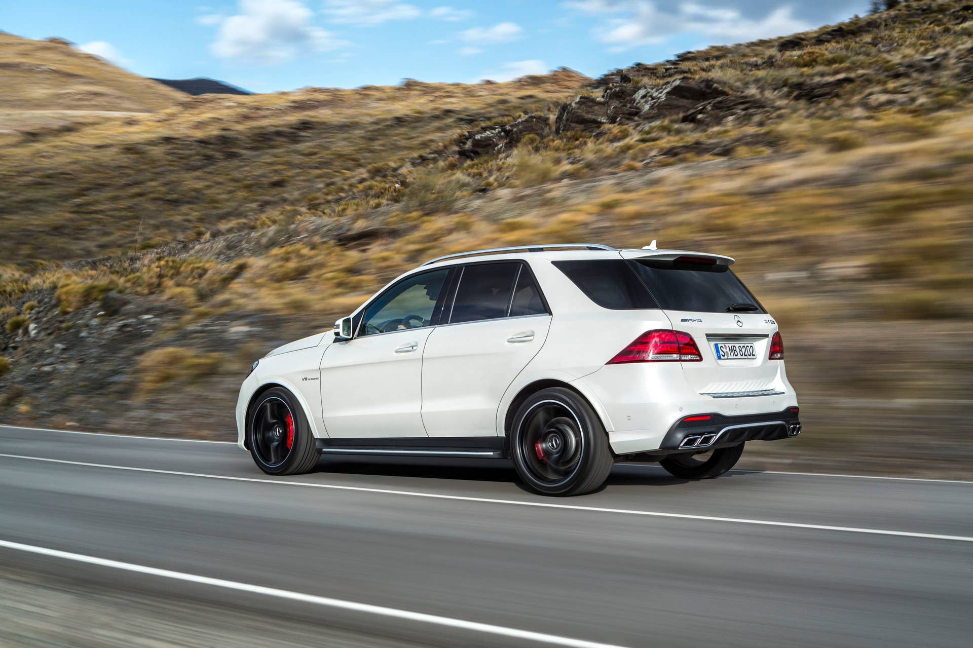 white mercedes gle63 s rear driving