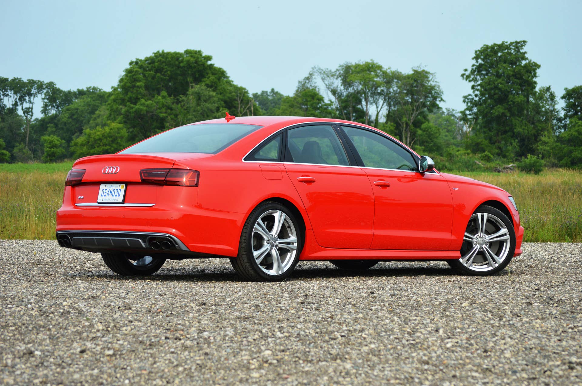 2016 audi s6 red back side view